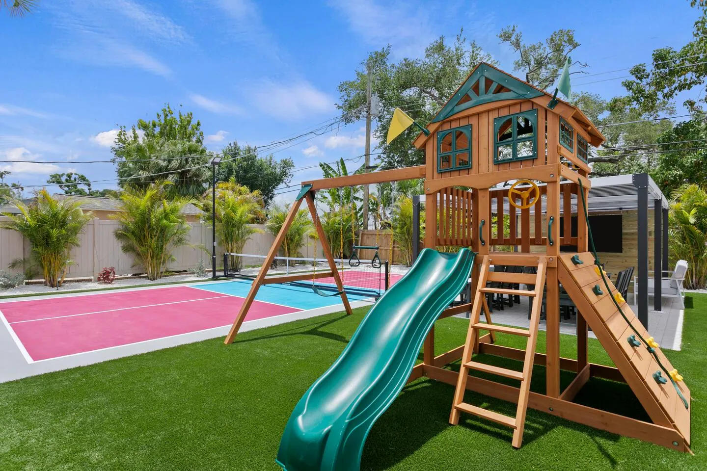 Playset with green slide with court at Salty House, Bradenton, Florida
