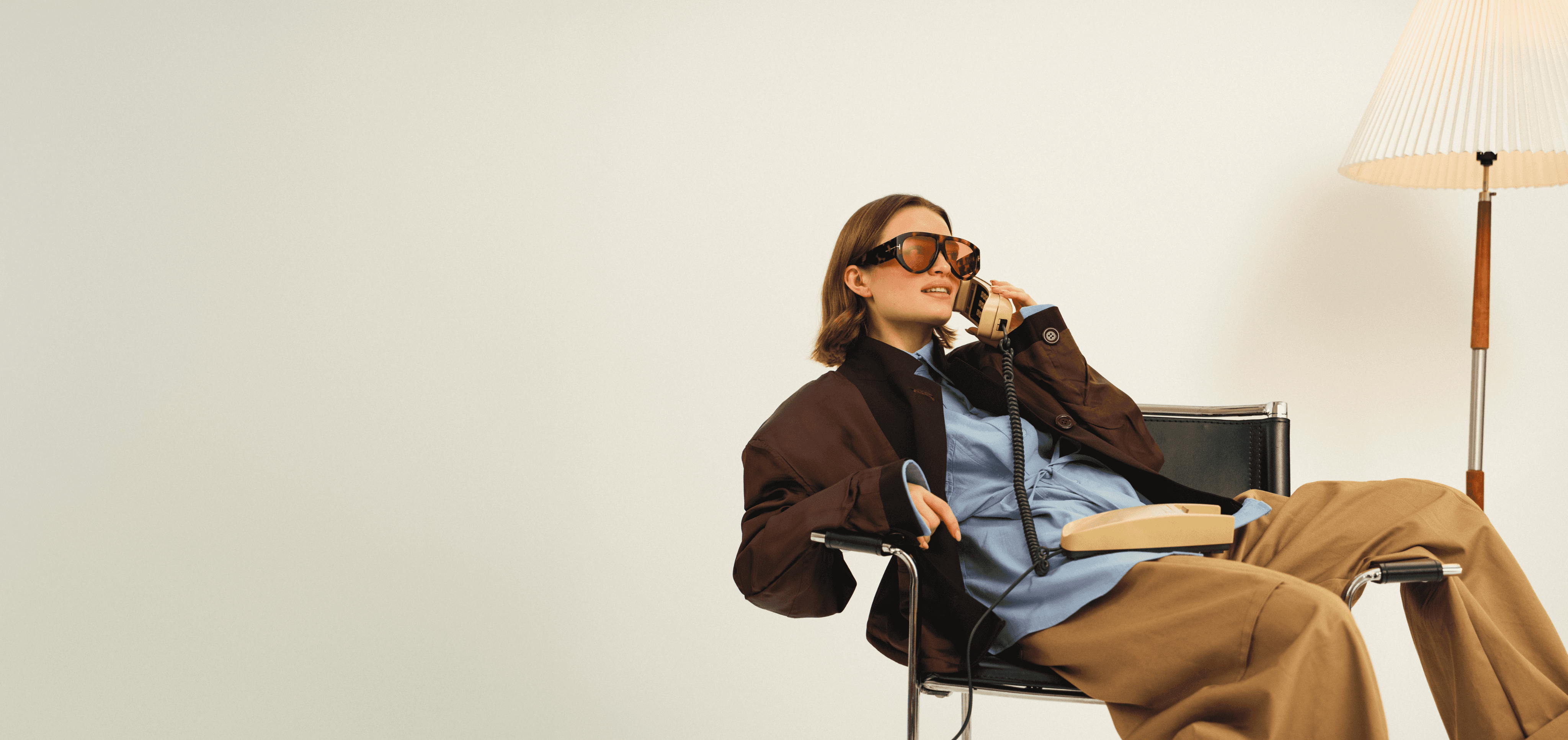 a woman in a red cape standing in the woods