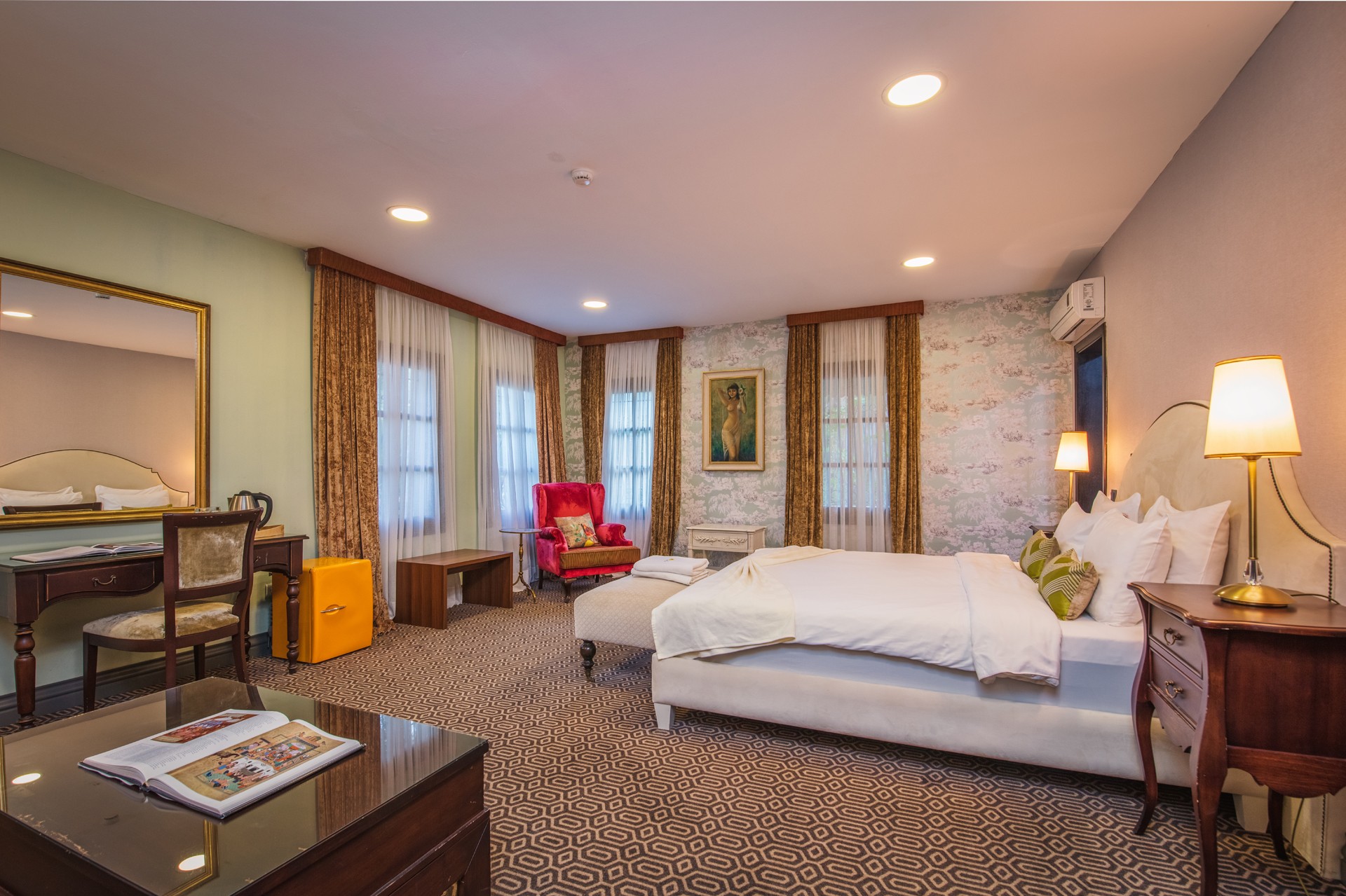 Living area composition, mid-century modern sofa, light wooden coffee table, woven textures, and curated coastal decor.