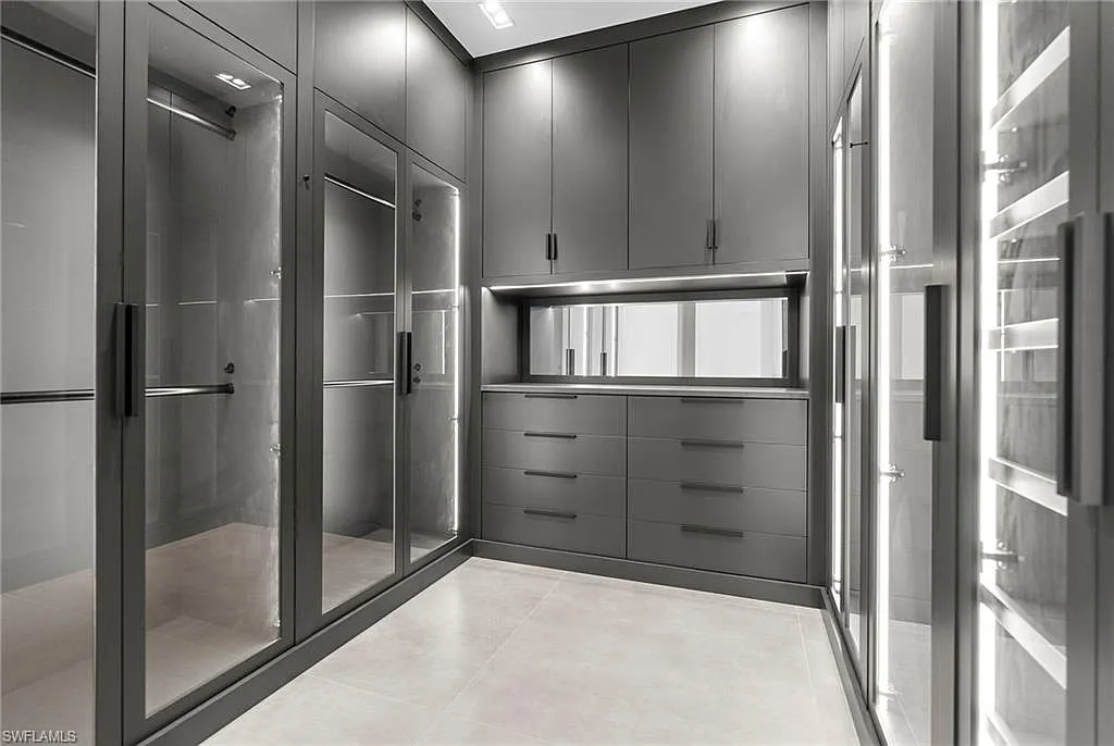 Spacious walk-in closet with organized built-in cabinetry