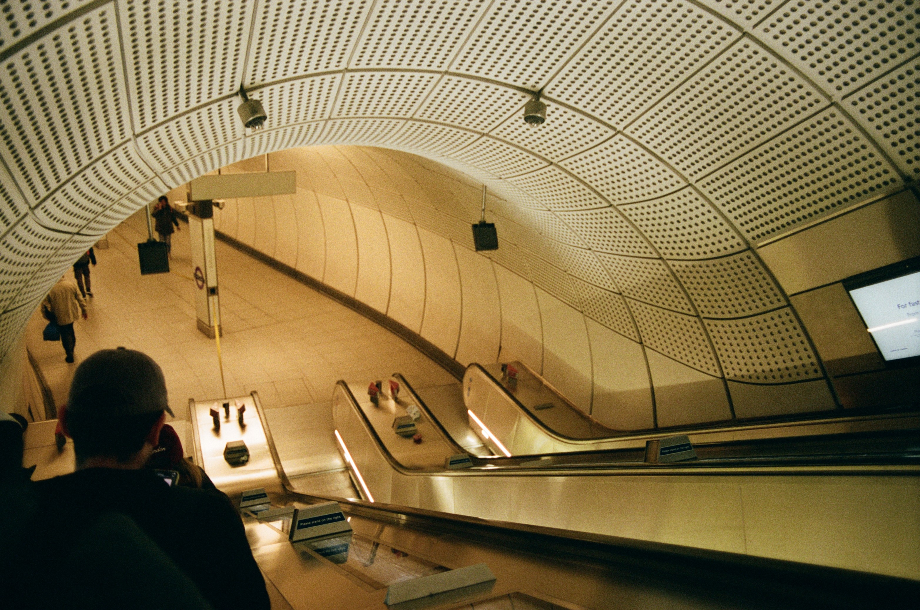 Modern skyscrapers line a busy highway in a sprawling city.