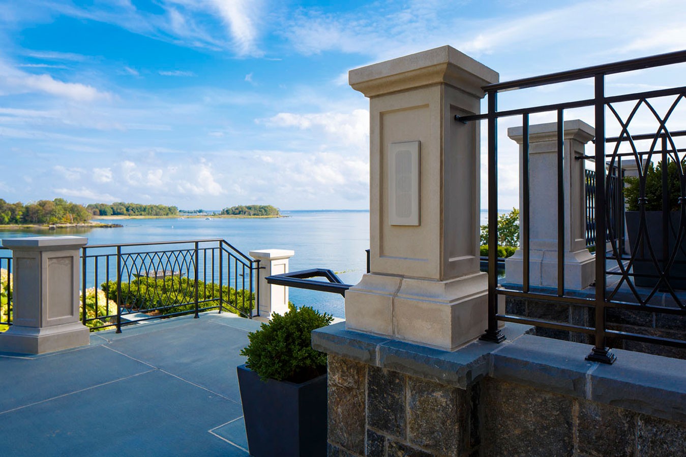 James Loudspeaker flush mount speaker installed in stone pillar on luxury waterfront terrace in British Columbia