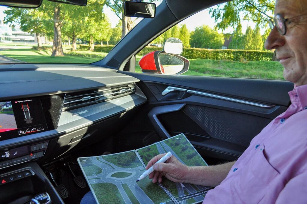 Close-up of a tree stump showing growth rings and a textured brown wood surface.