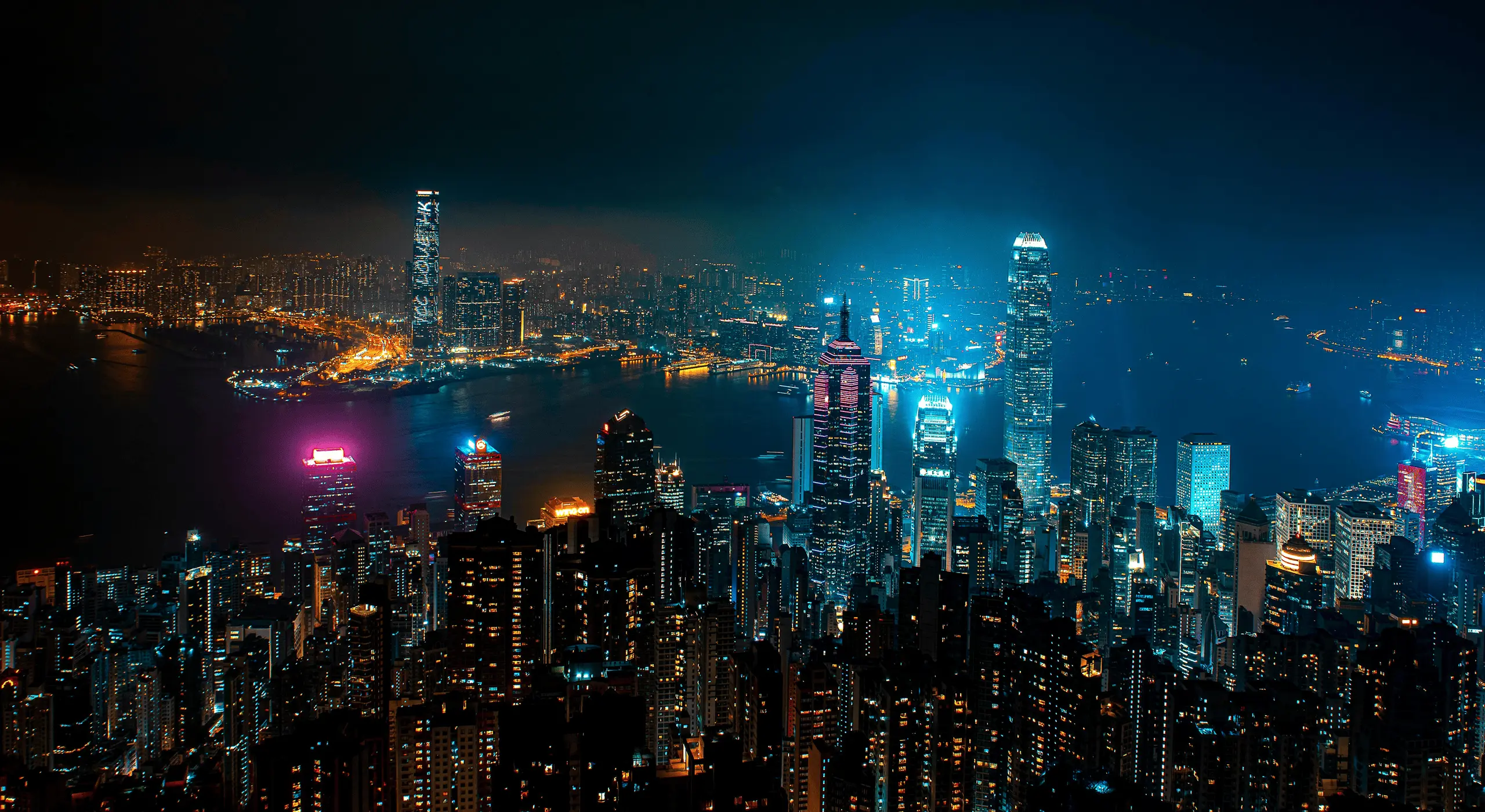 Panoramic night view of the Hong Kong city skyline.