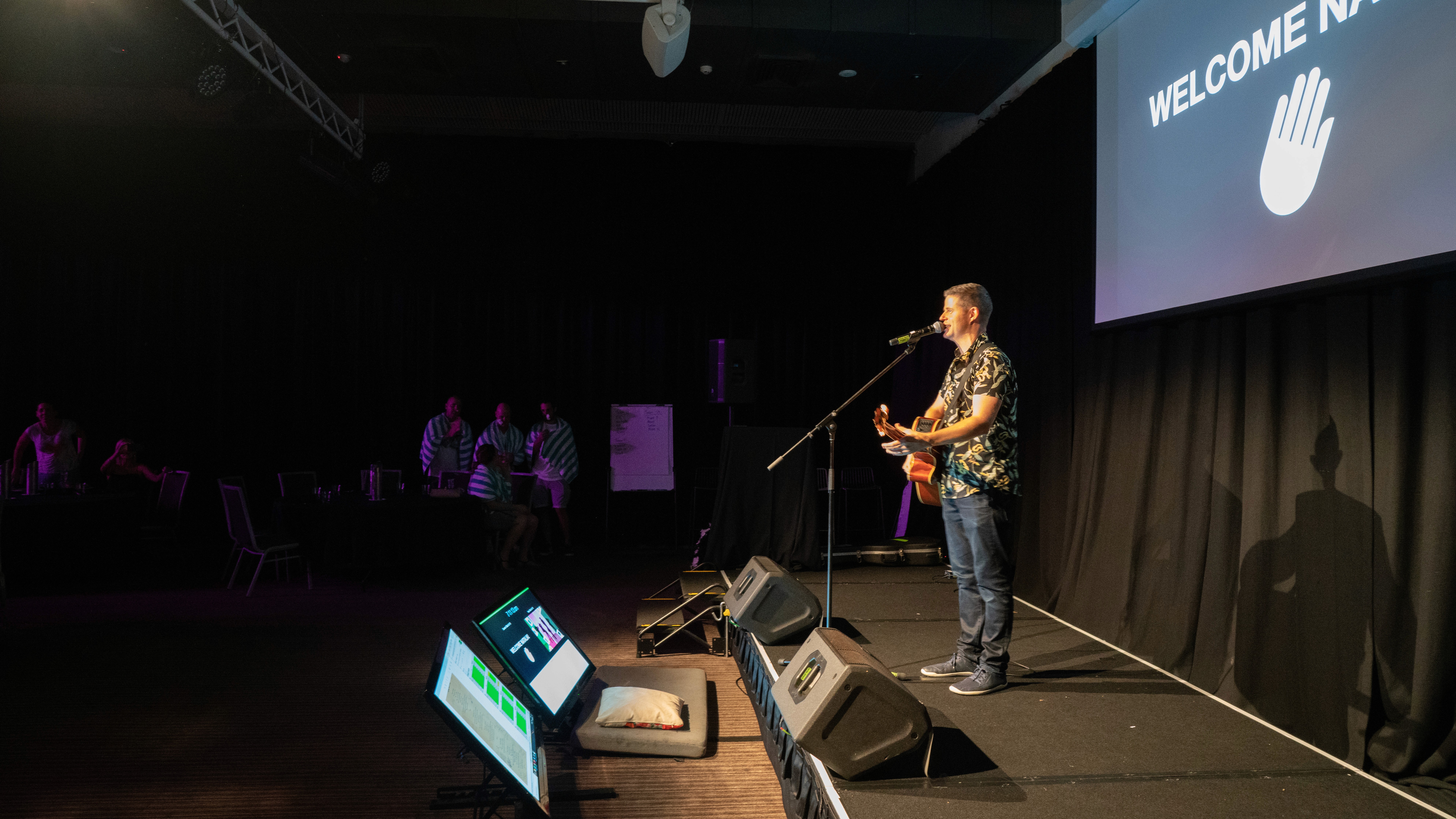 A Man Talking using Microphone in the Conference Room