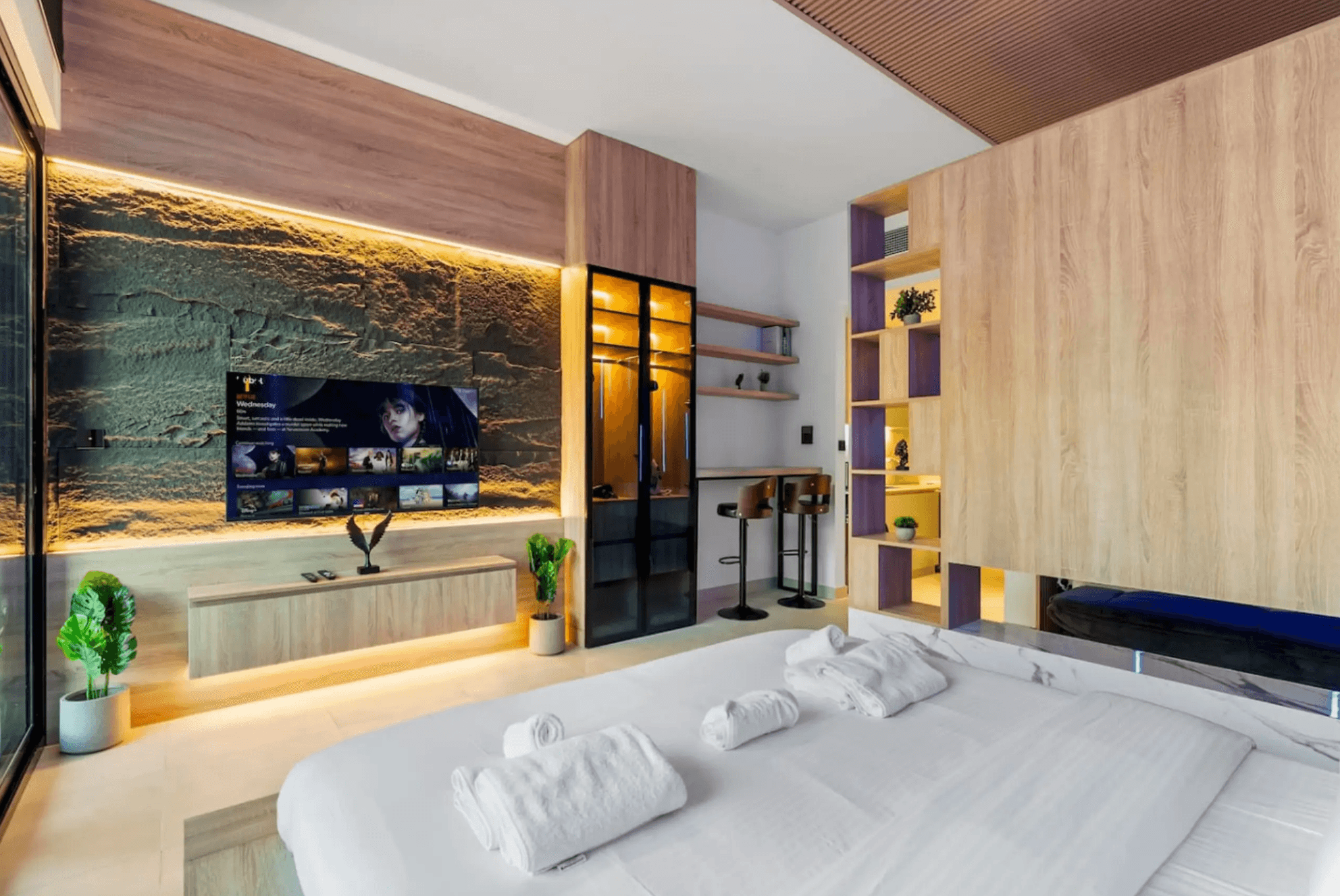 a living room filled with furniture and a mirror