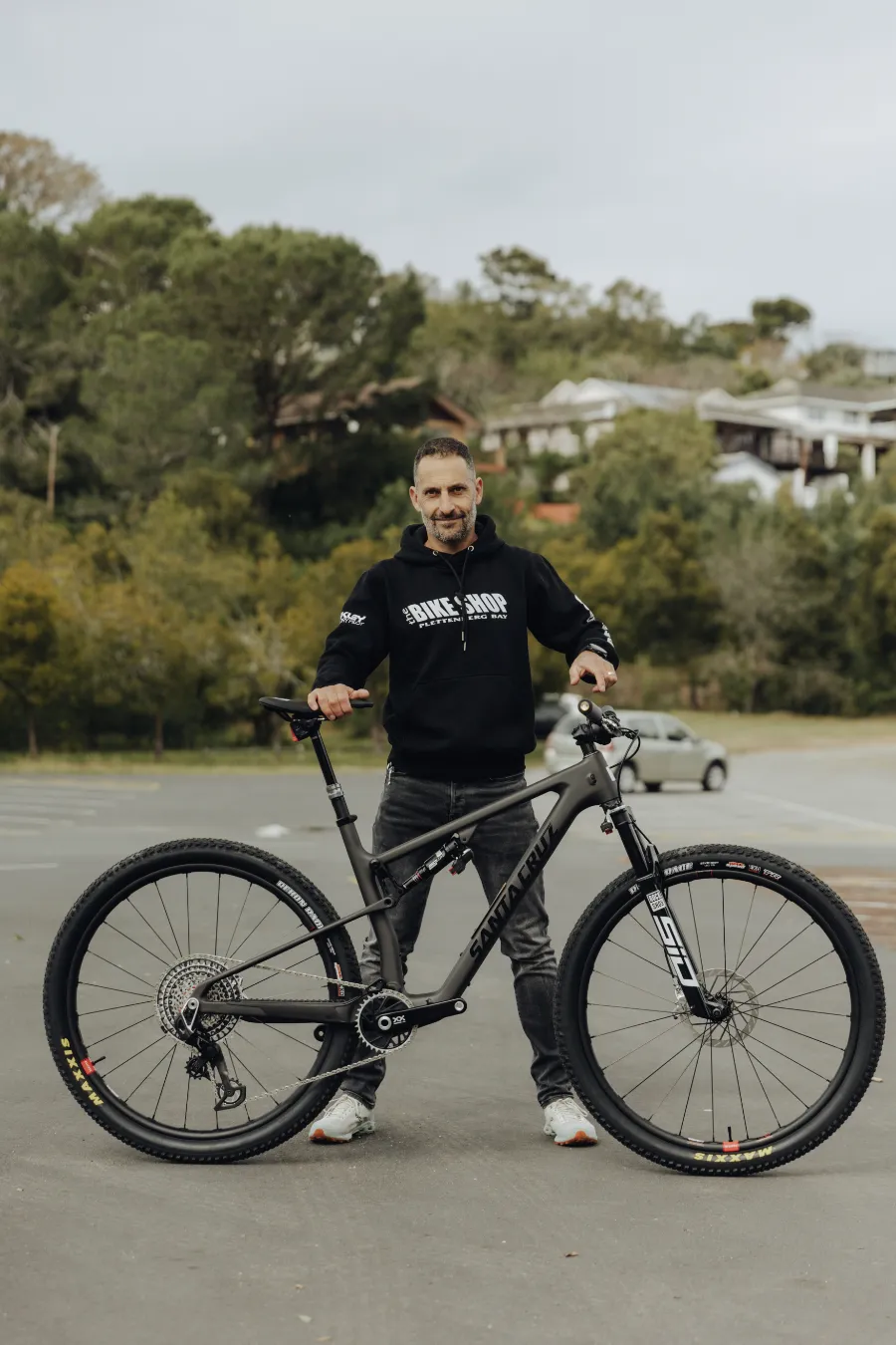 Kevin Evans Holding a Bicycle 