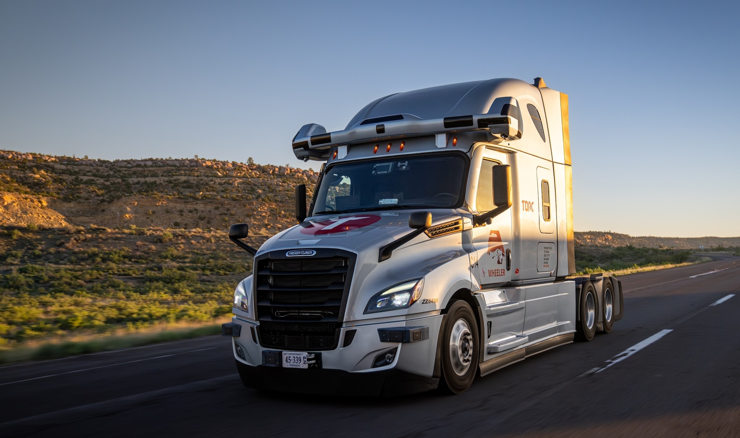  Self-driving Torc Robotics truck navigating a highway as part of the autonomous trucking revolution. 