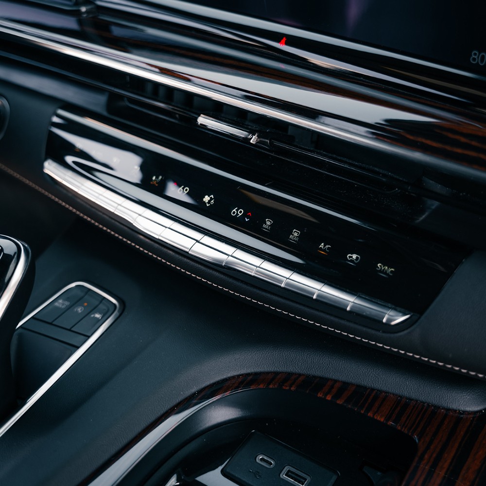 Close-up of Cadillac Escalade center controls and piano black trim