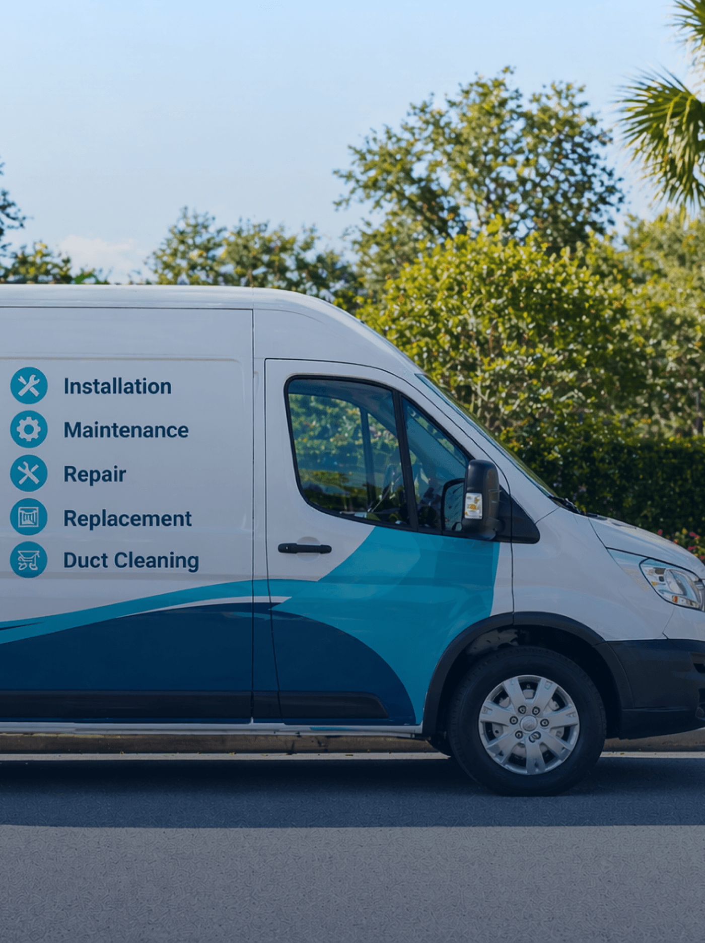 White and blue HVAC service van parked on a sunny street with service list on the side.