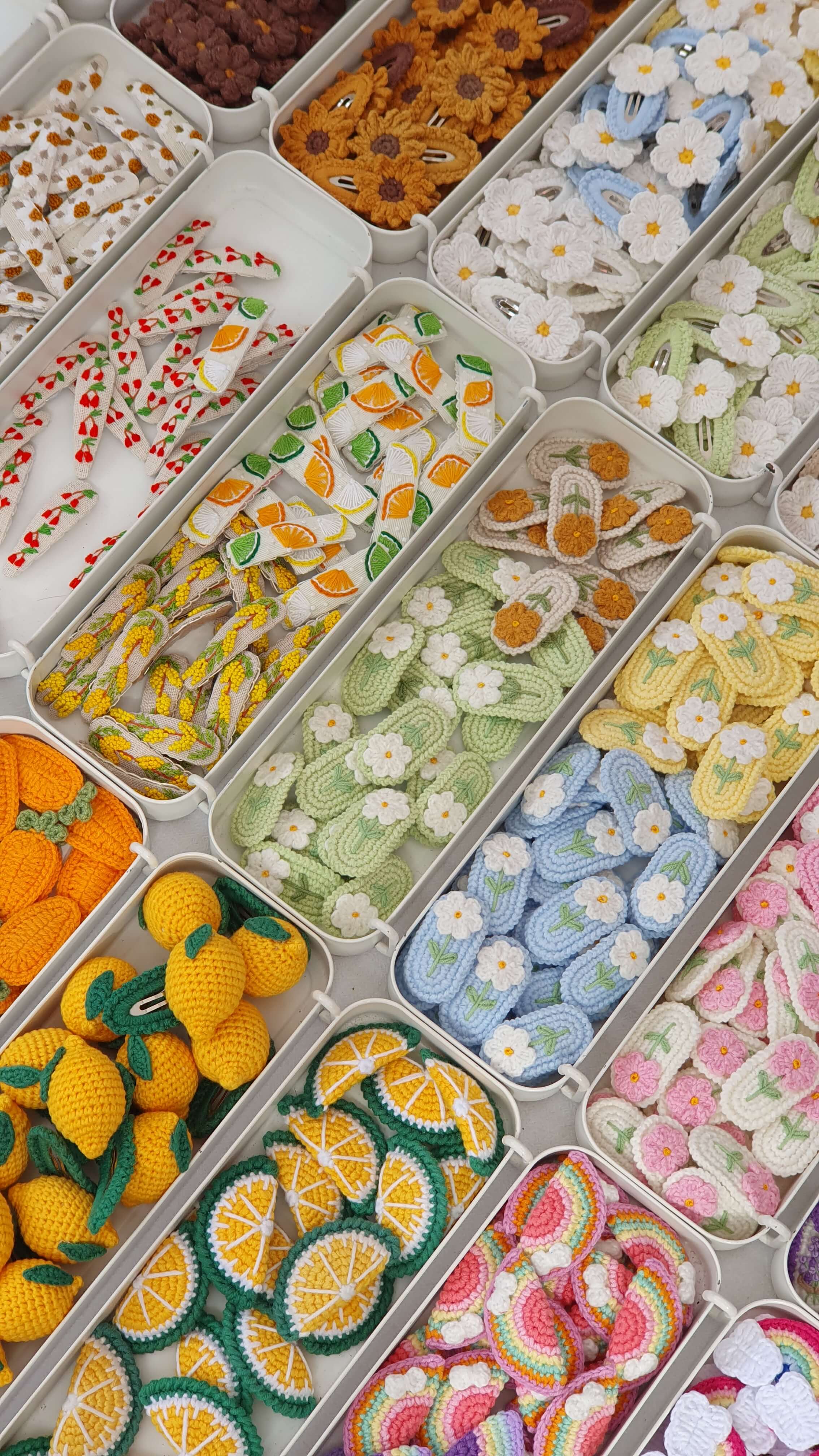 boxes of knit patches lined up in rows