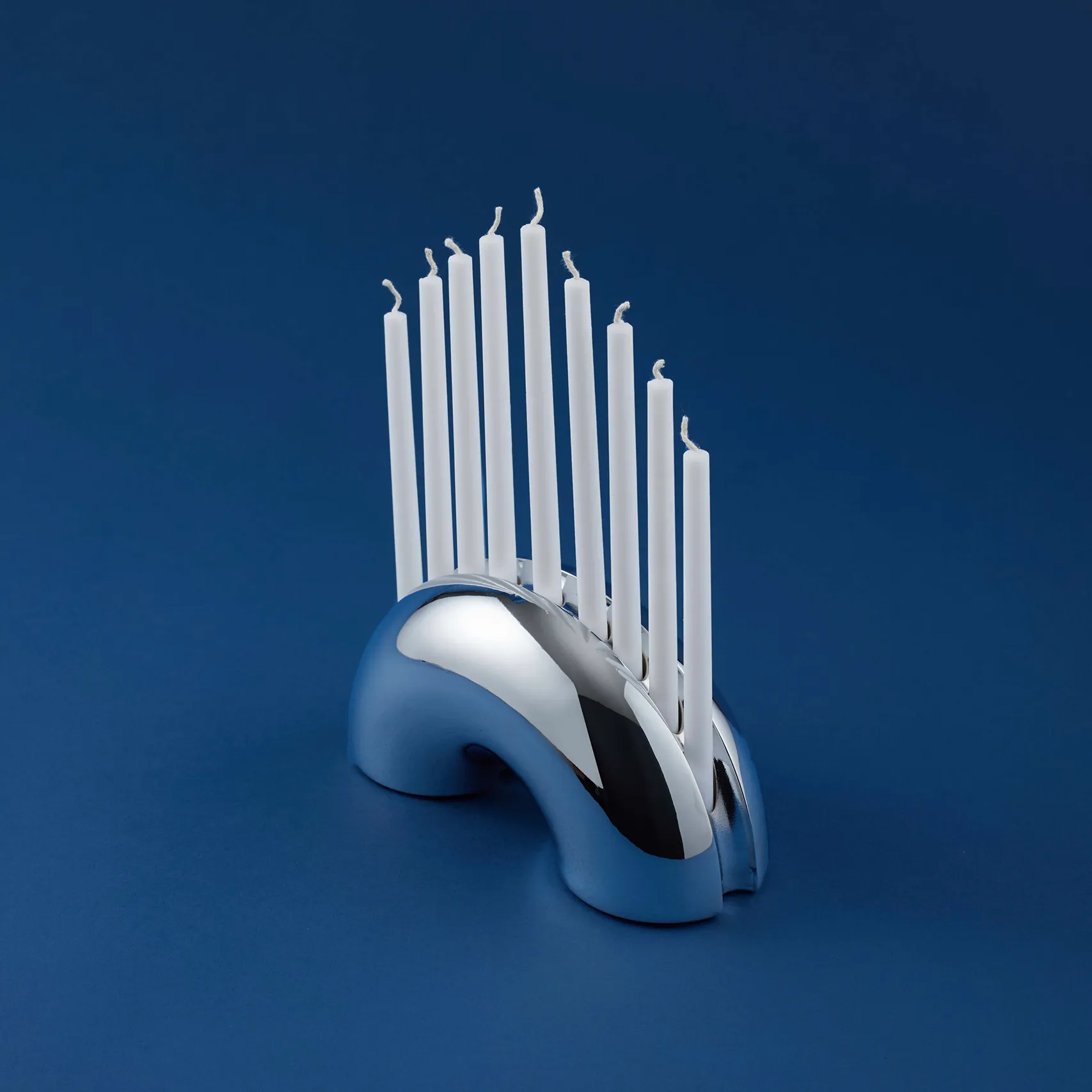 Nosh Menorah product displayed against a dark blue background