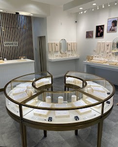 Showcase of lab grown and natural diamonds at Vanhess Jewelry Coquitlam, where clients select gemstones for their custom engagement rings.