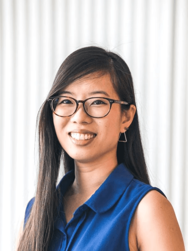 Portrait of a happy client sharing feedback: AIspire automated our processes, saving us hours weekly. It’s intuitive and allowed us to focus on strategic goals.