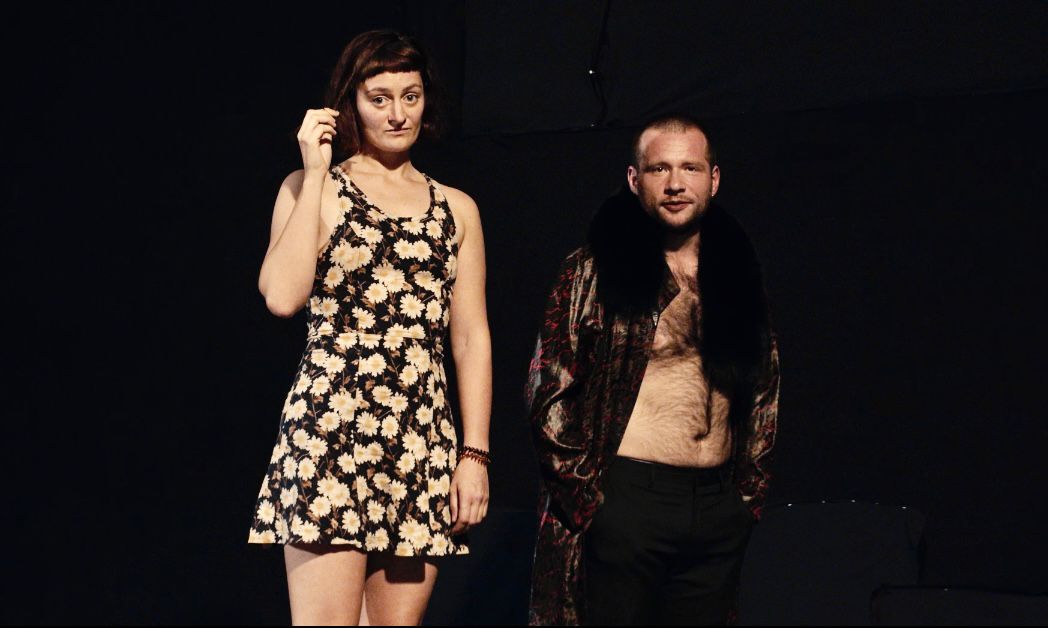 Athletes resting on a track after training.