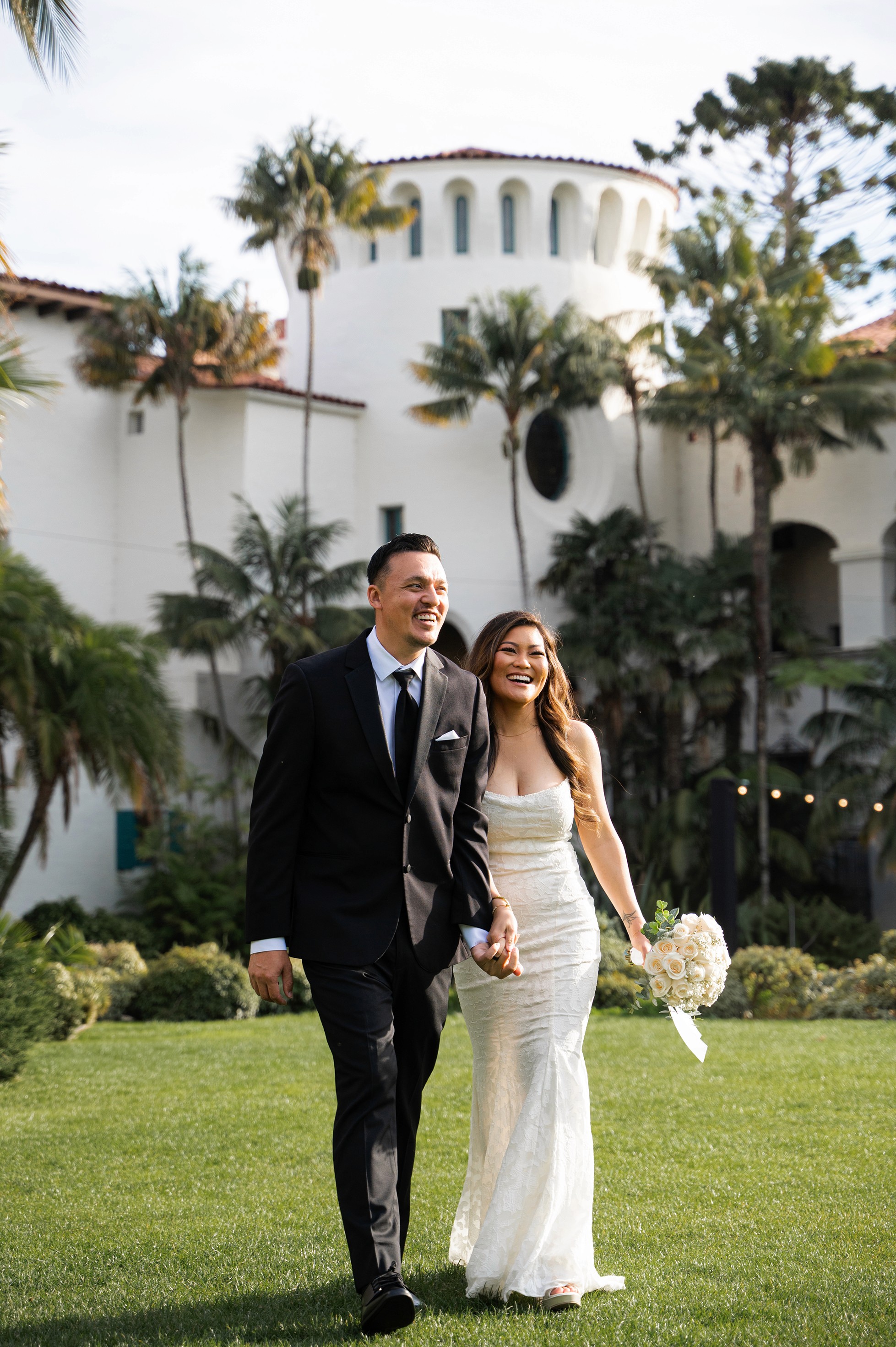 Bride and groom portrait at Santa Barbara Courthouse Sunken Garden on a partly cloudy day