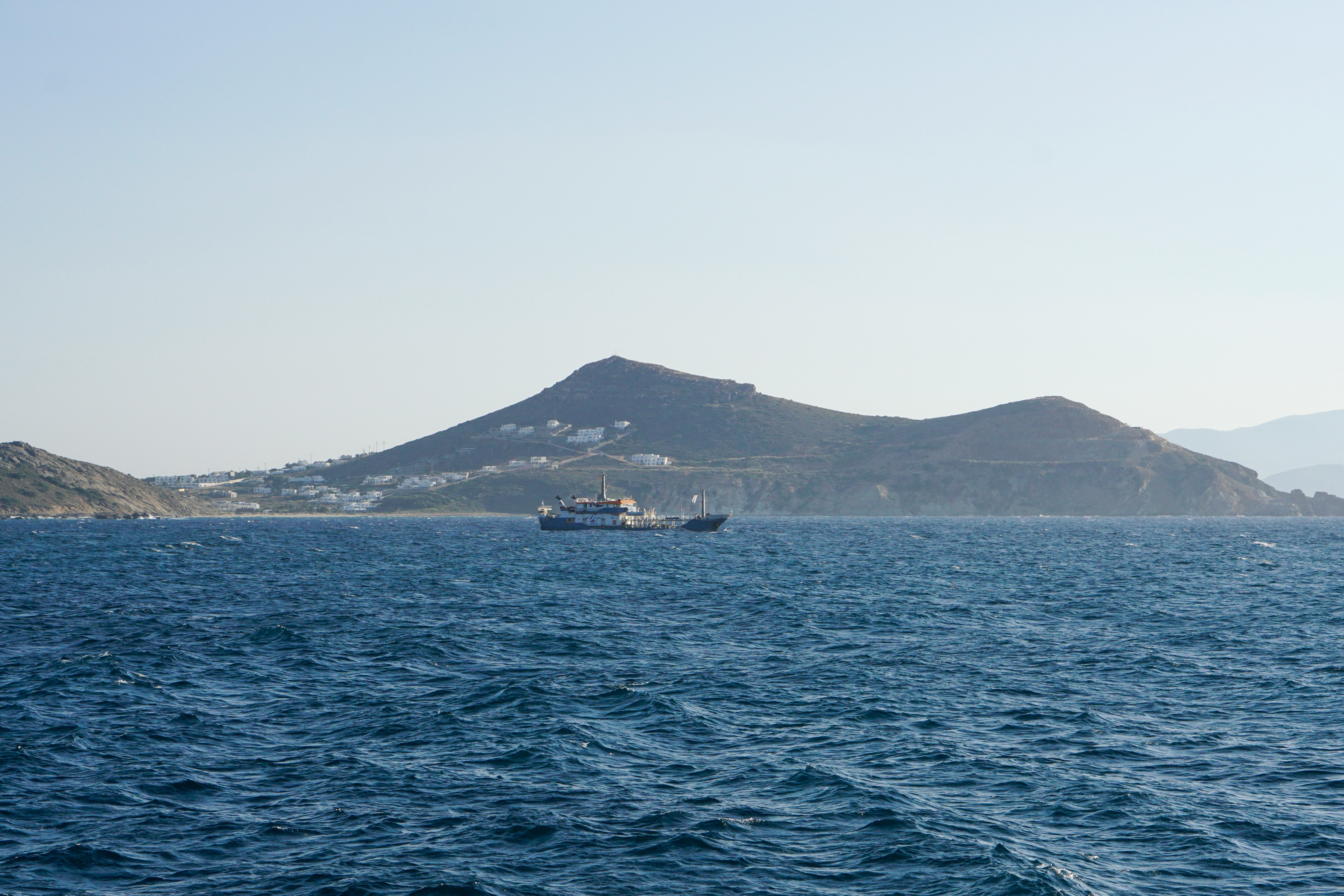 A yacht sailing beside the coast of Naxos in the Cyclades