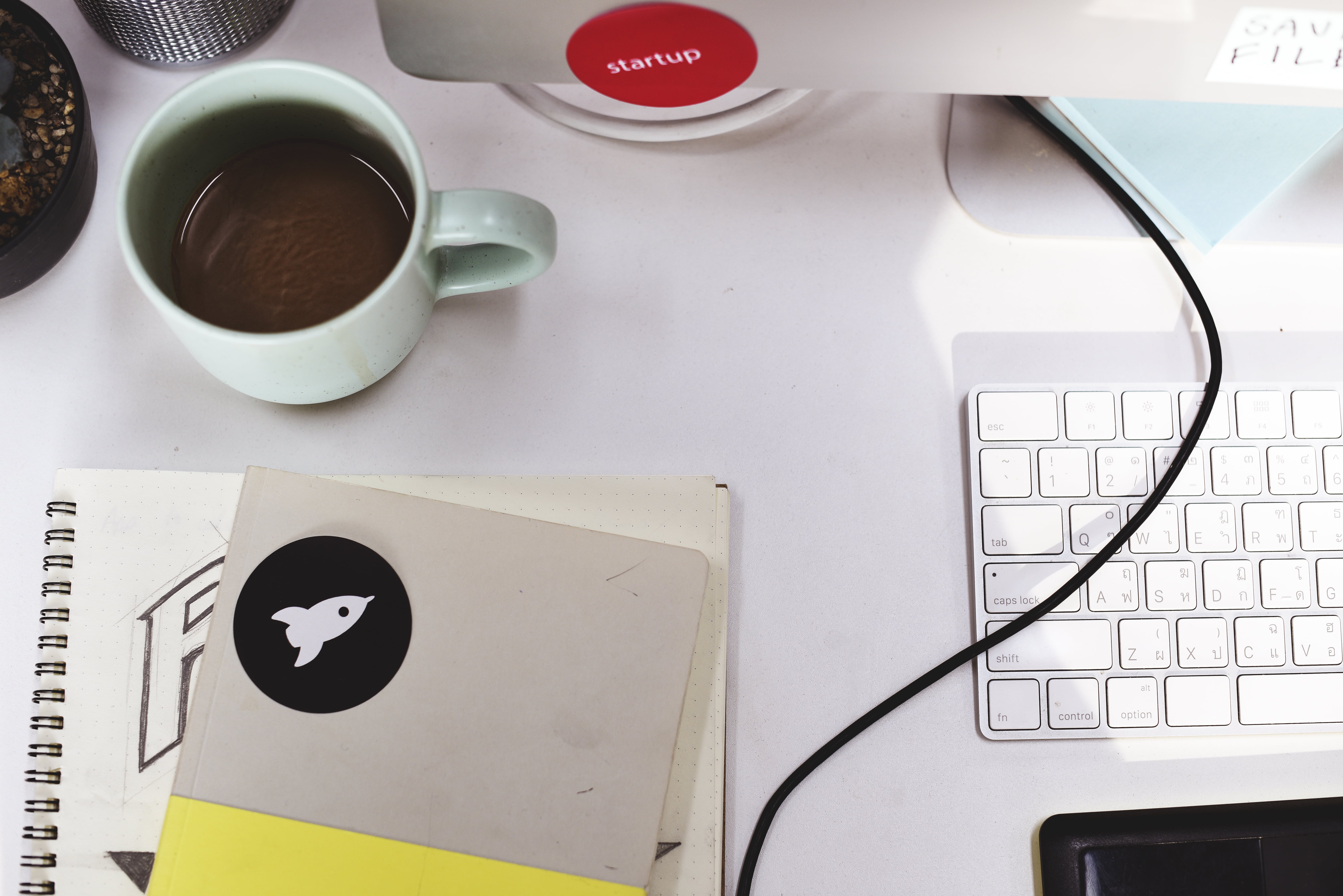 Modern workspace with startup notebook and design tools used for professional logo redesign process