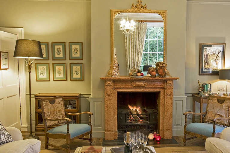 Hartingtons Heritage Tours hotel, Darley House, Sitting room with fire place