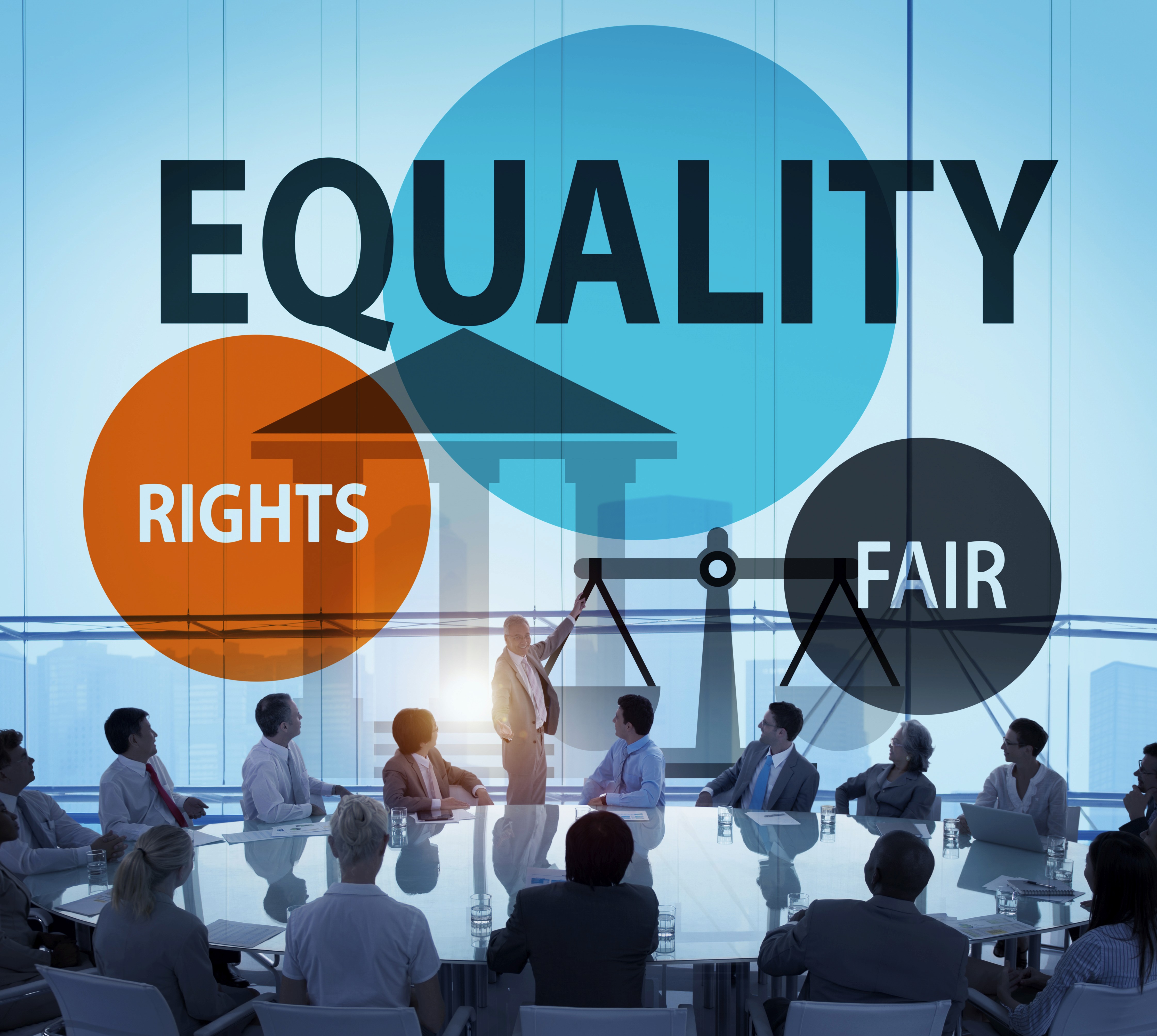 a man sitting in front of a laptop computer