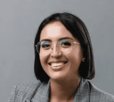 A happy customer smiling wearing orange headband