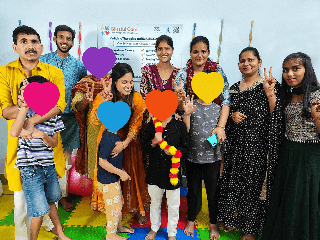 Blissful Care Center pediatric therapy team supporting a child and family during a joyful therapy session.