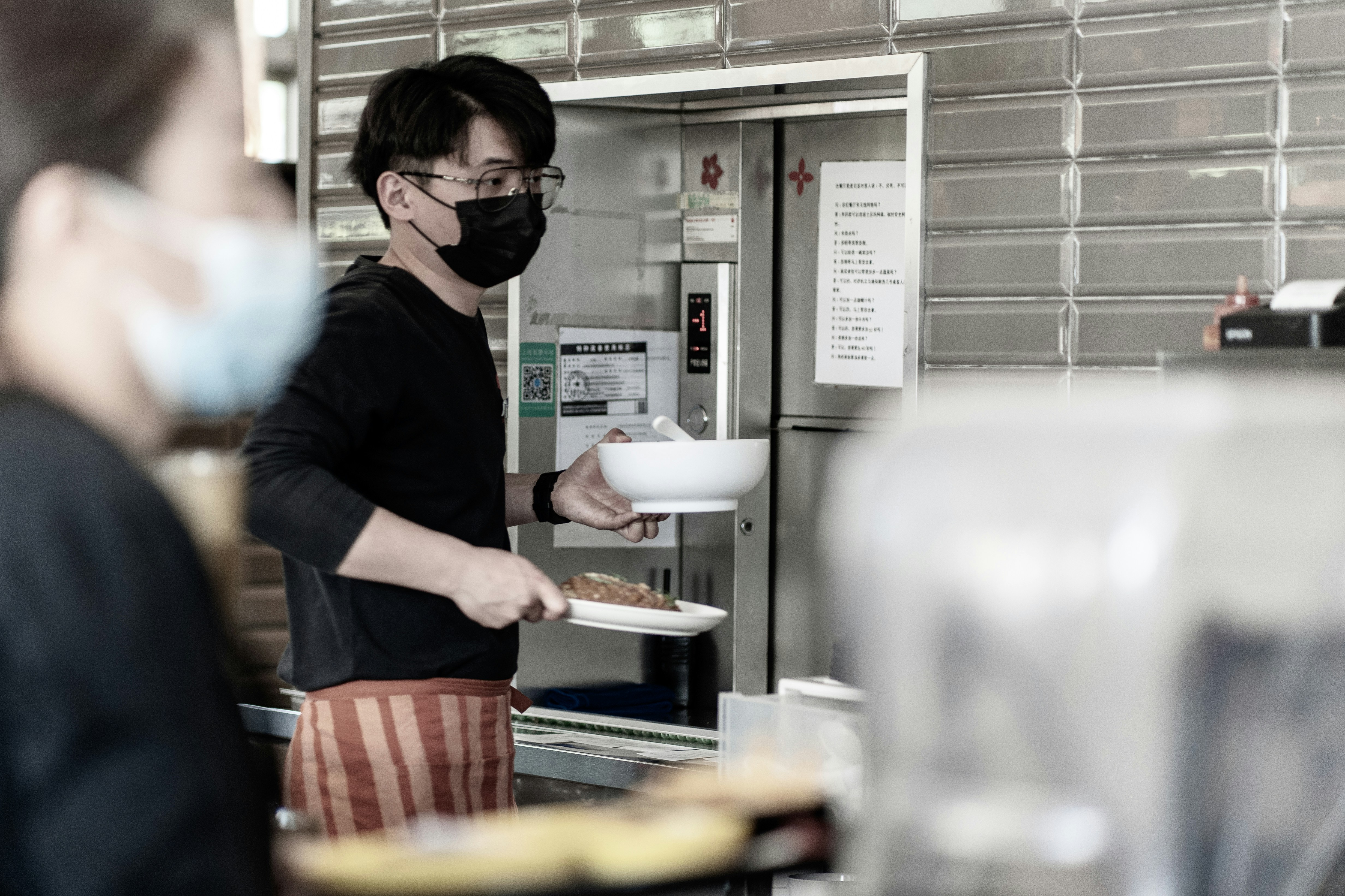 man in black t-shirt wearing black sunglasses
