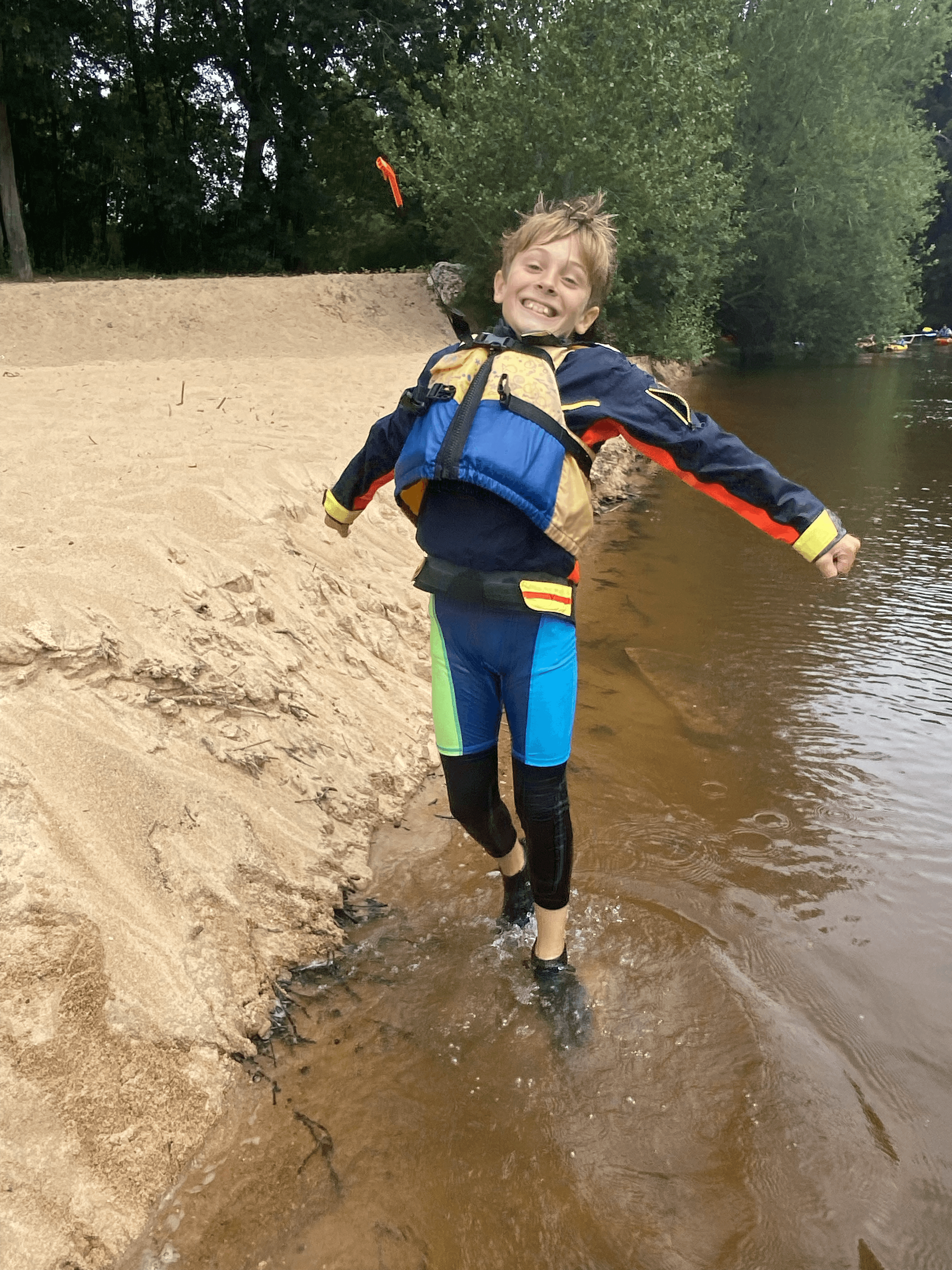 A man stading with Surfboard