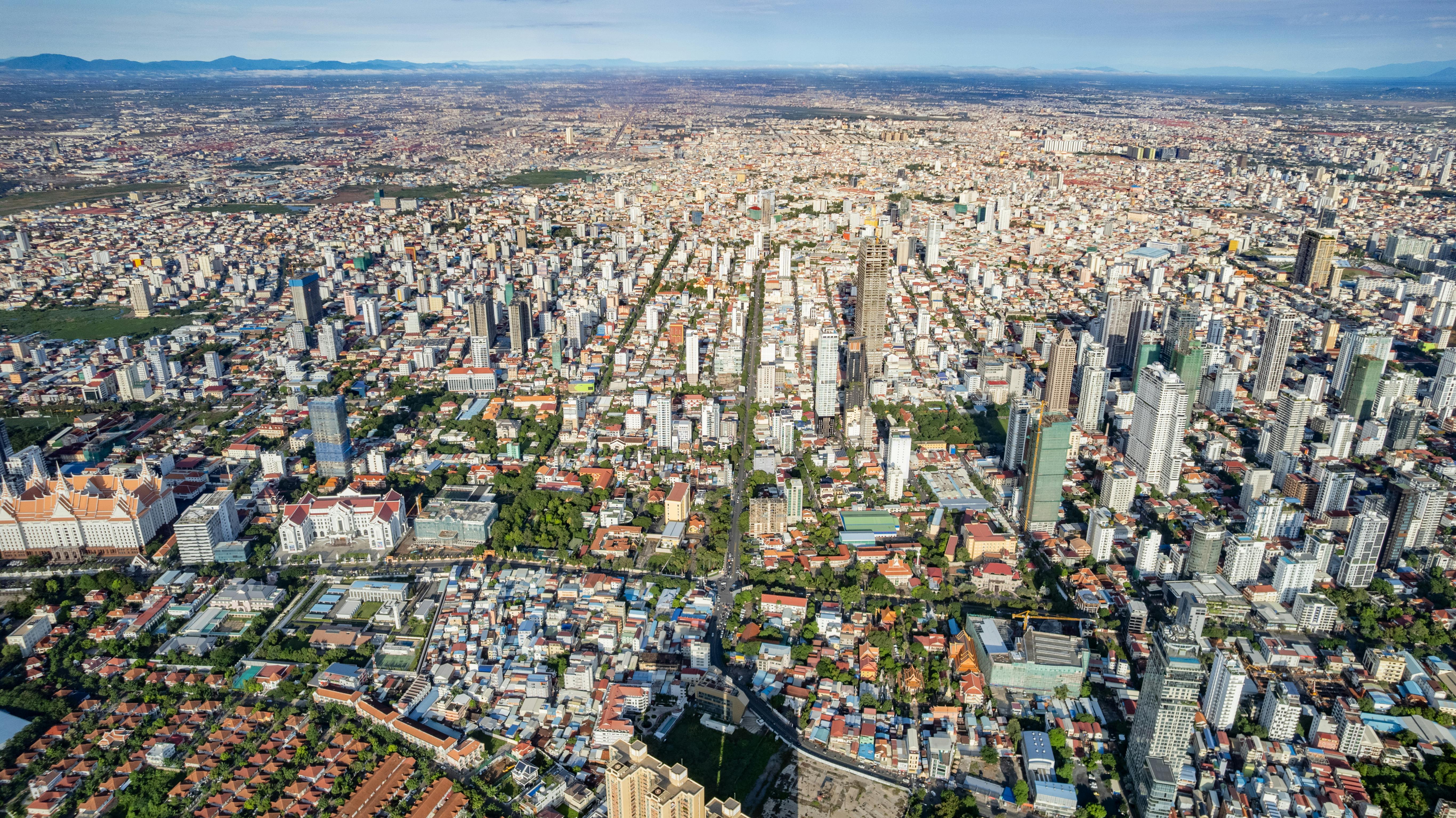 Park Hyatt Siem Reap courtyard pool view, luxury boutique hotel architecture blending Khmer and art deco styles.
