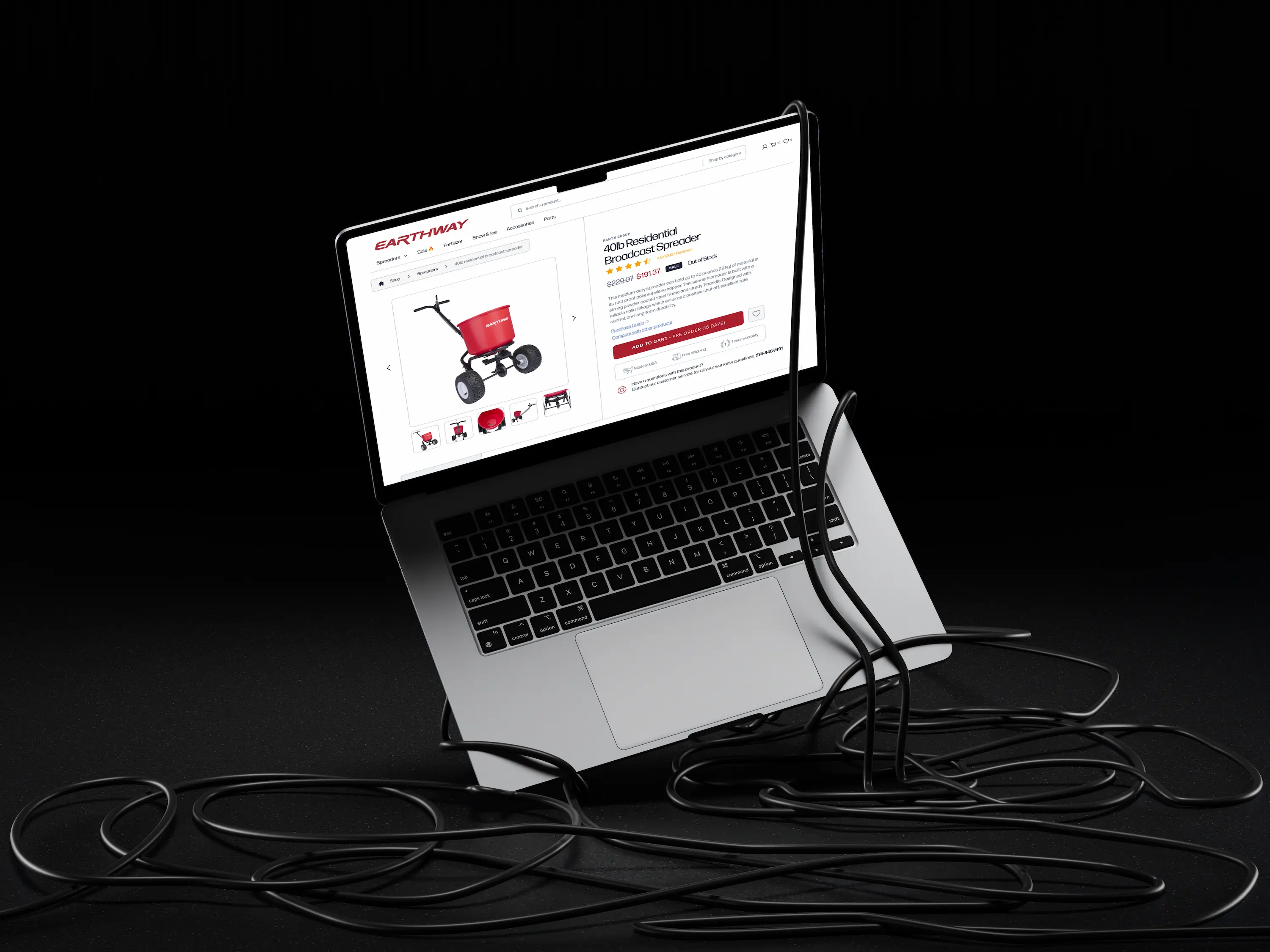 A laptop with an open screen displaying graphics and text, set against a black background.