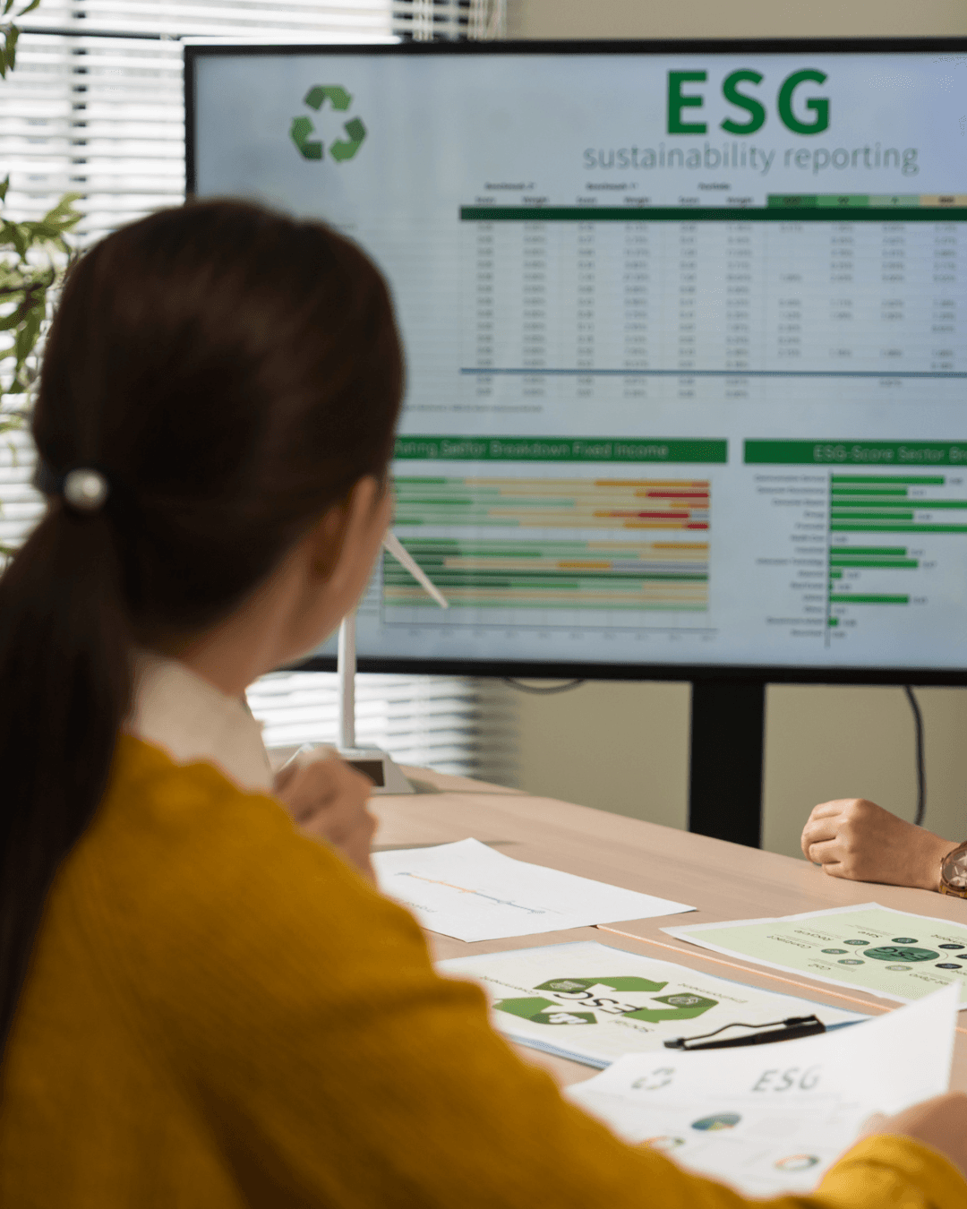 Woman looking at an ESG screen