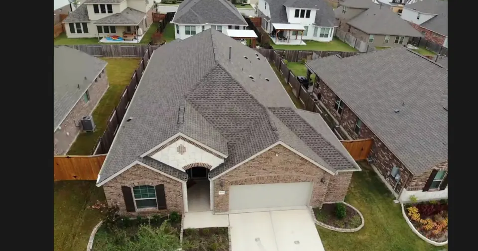Aerial view of the architectural shingle roof in Pflugerville, Texas, completed in 2020; roof overview used to introduce the installation topic.