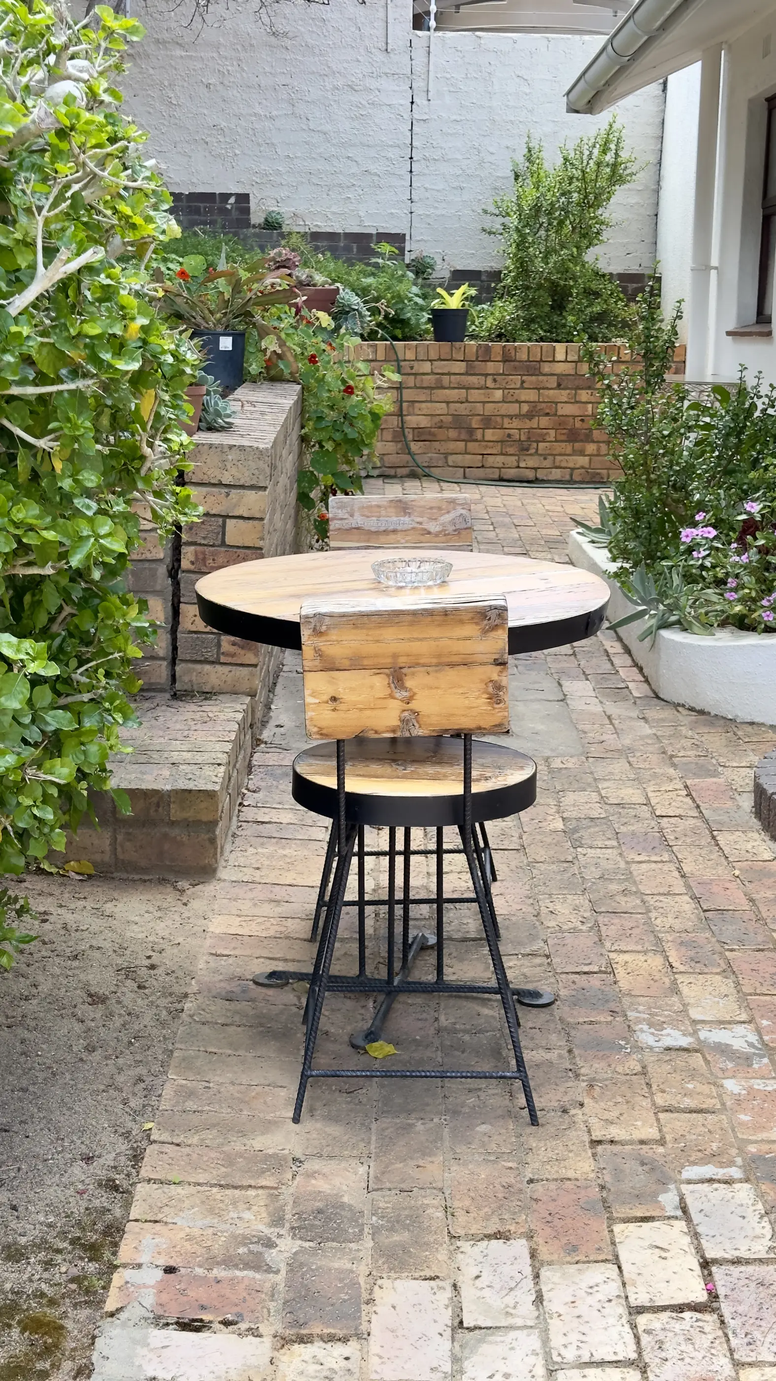 Outside table and chairs near the entrance to our Escape to 8 room.