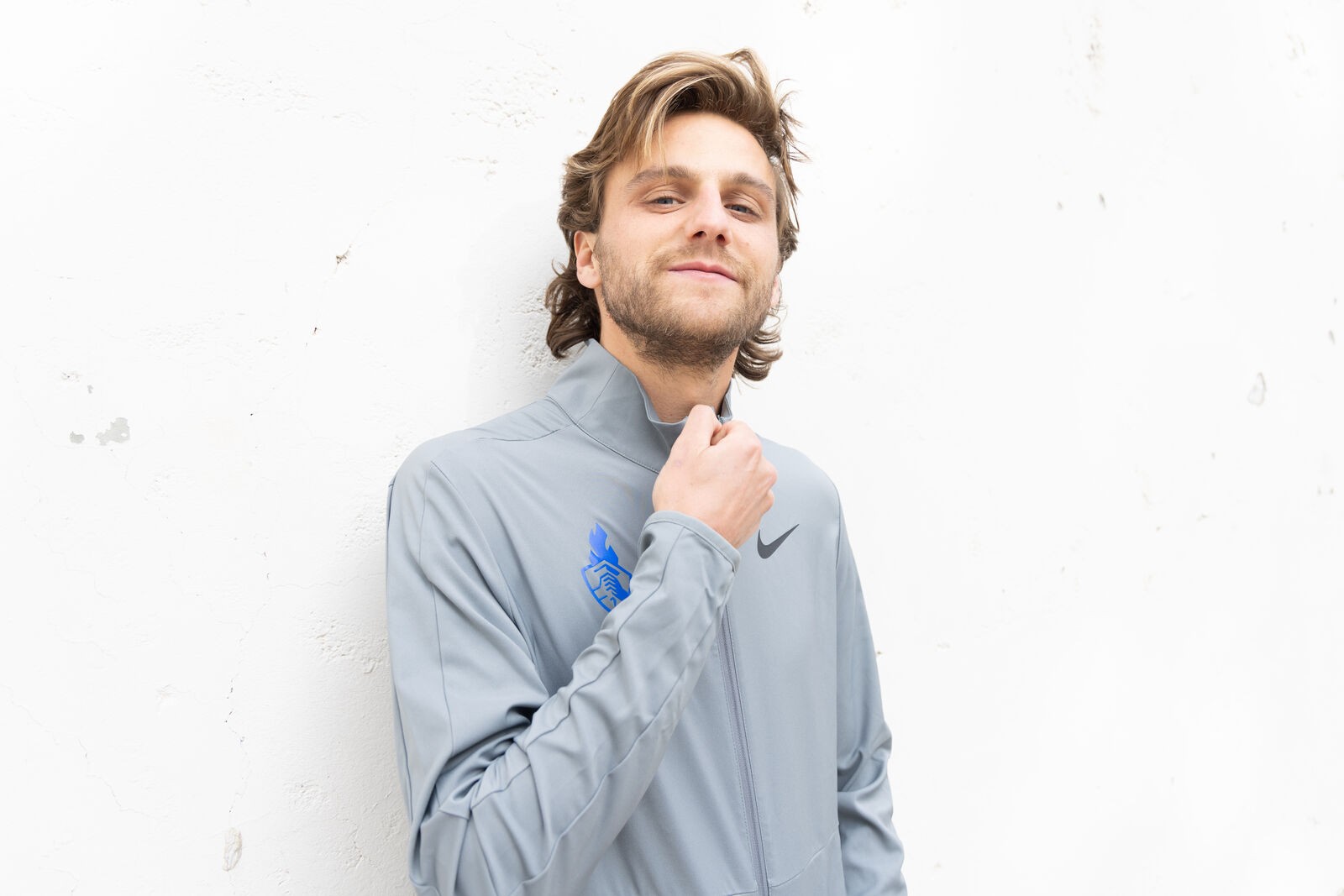Nike shoot, an athlete in a grey quarter-zip
