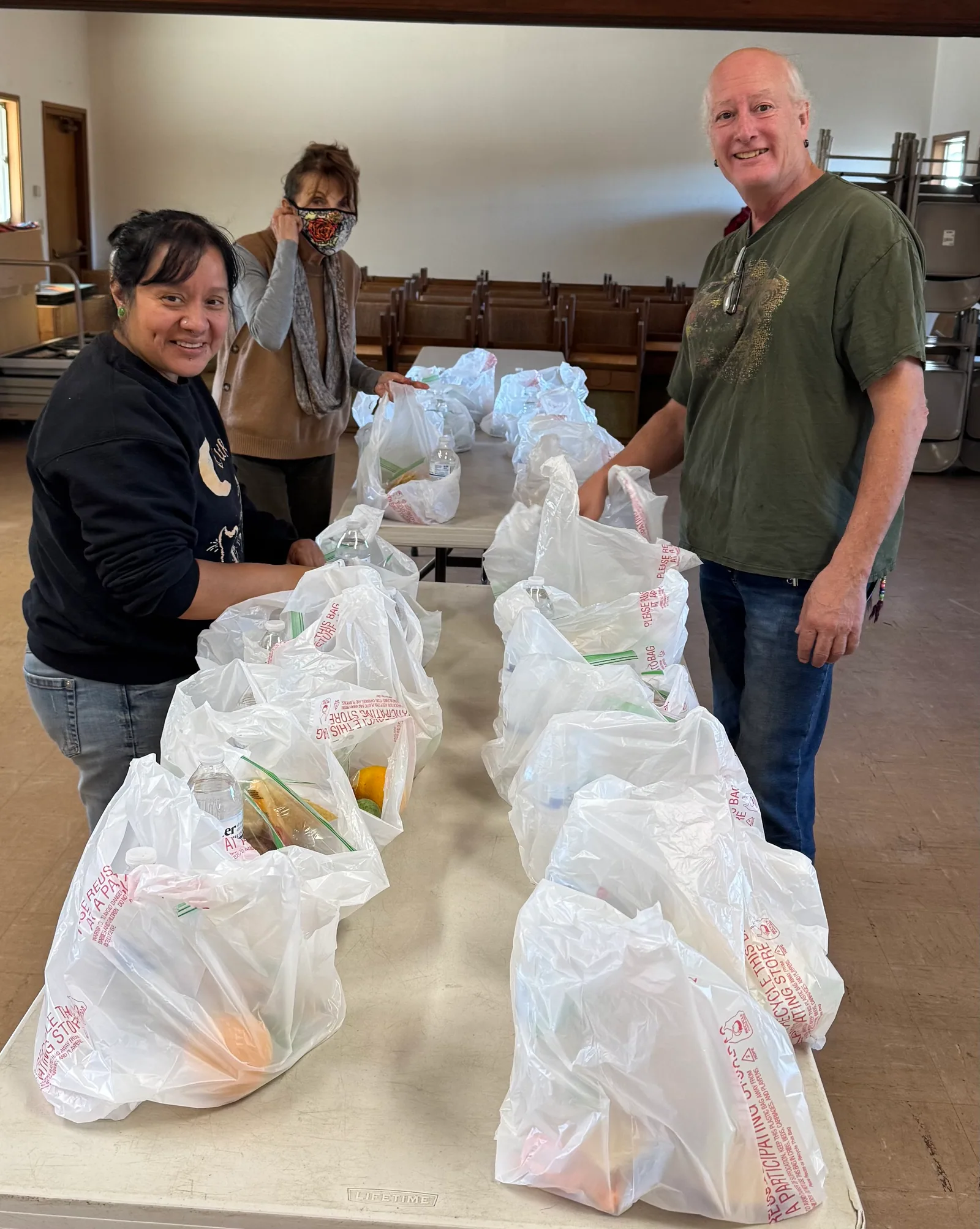 Volunteers preparing and packing food together