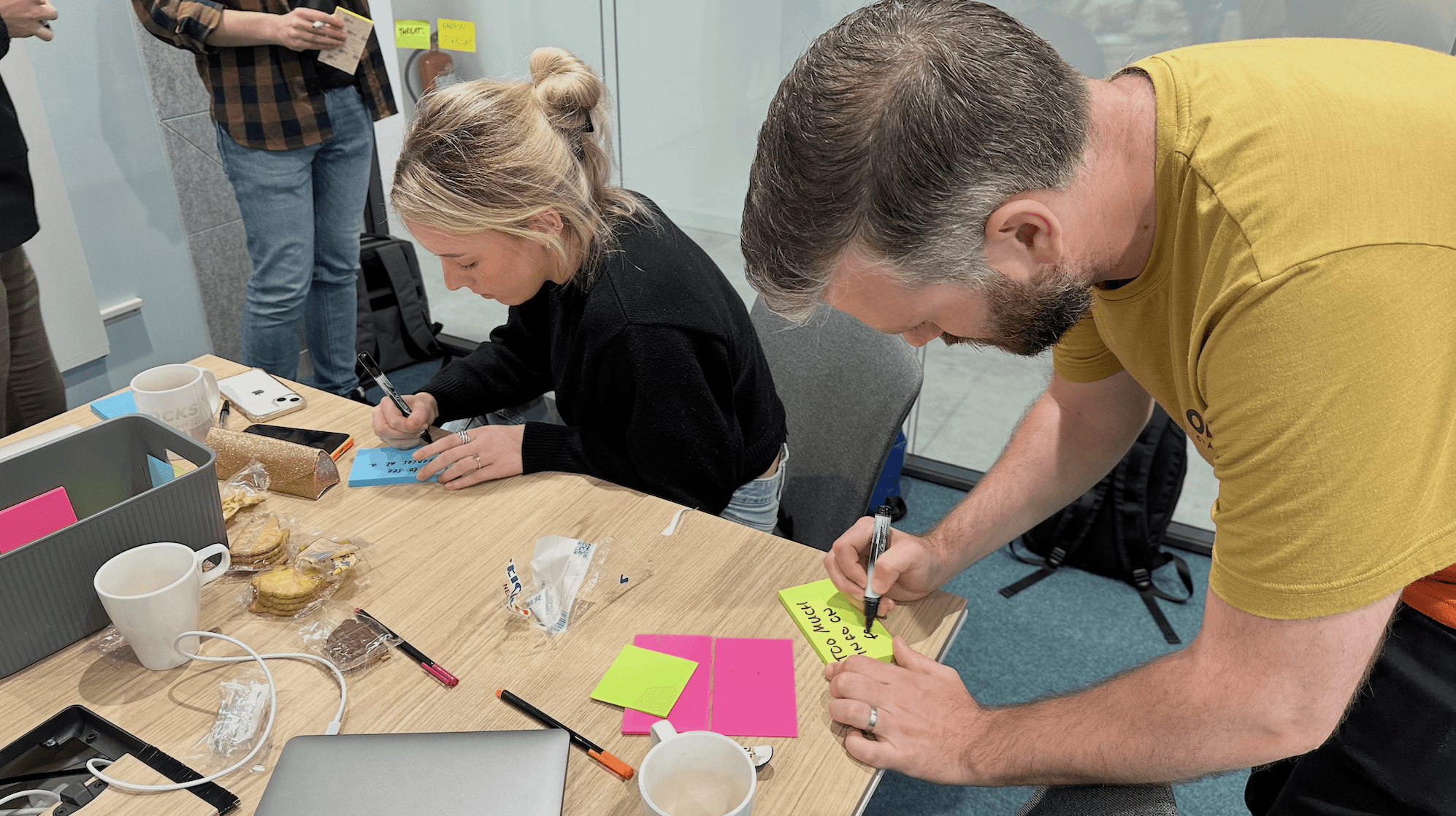 people in a large building with Tate Modern in the background