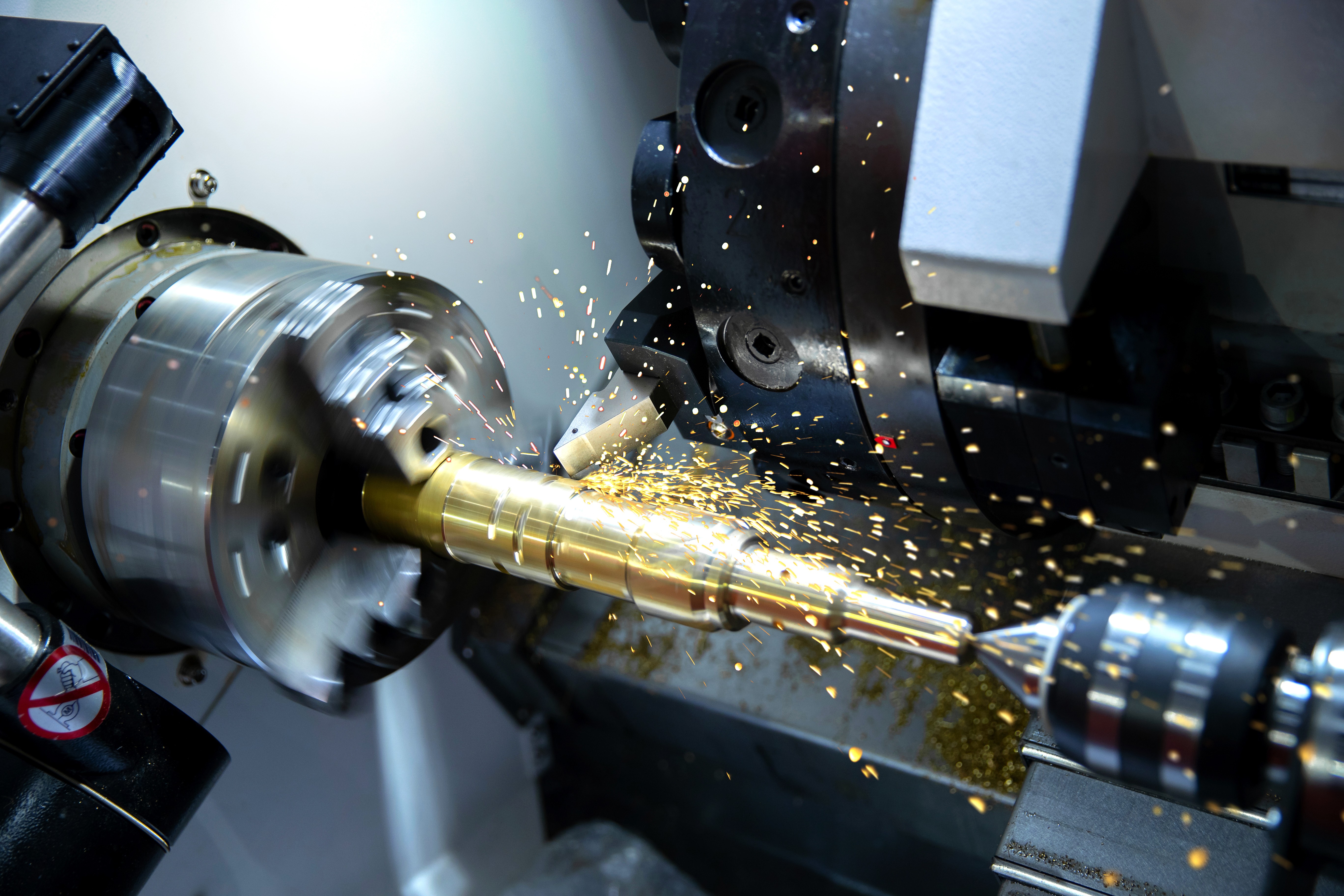 A CNC machine turning metal into a more precise model by Automech