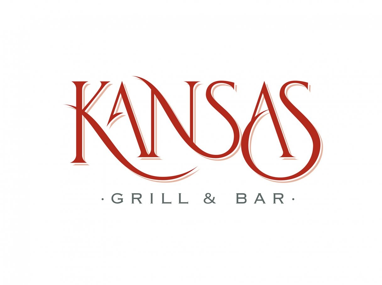 Rustic cabin in a golden field at sunset