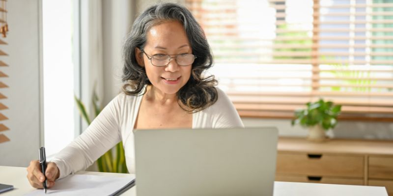 A Malaysian business owner on her laptop