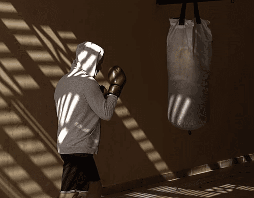 Two people stretching on yoga mats