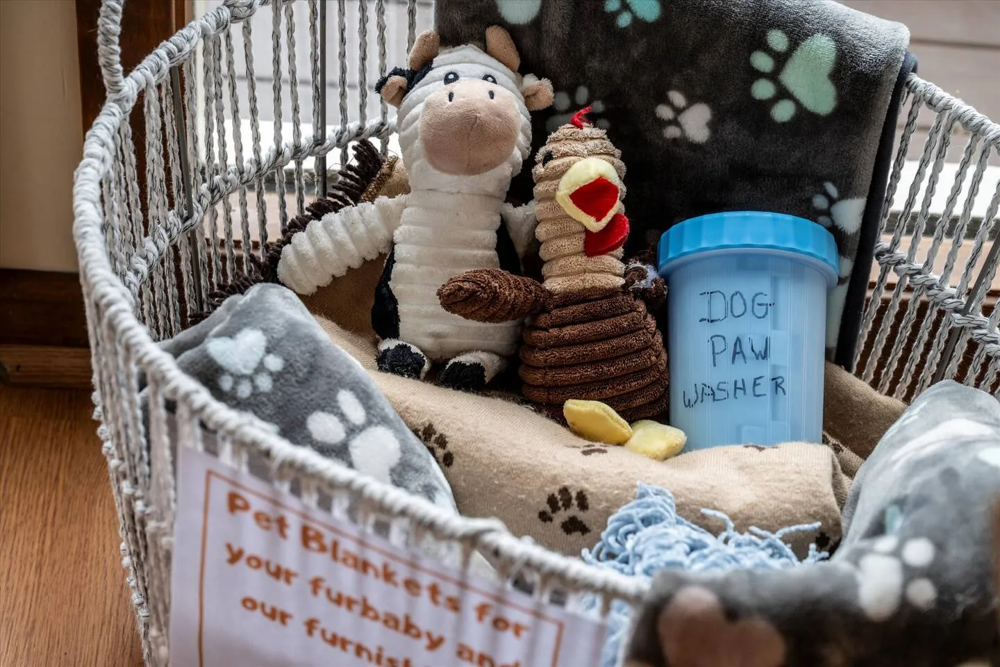 Pet basket with toys and a dog paw washer at Bella Vista