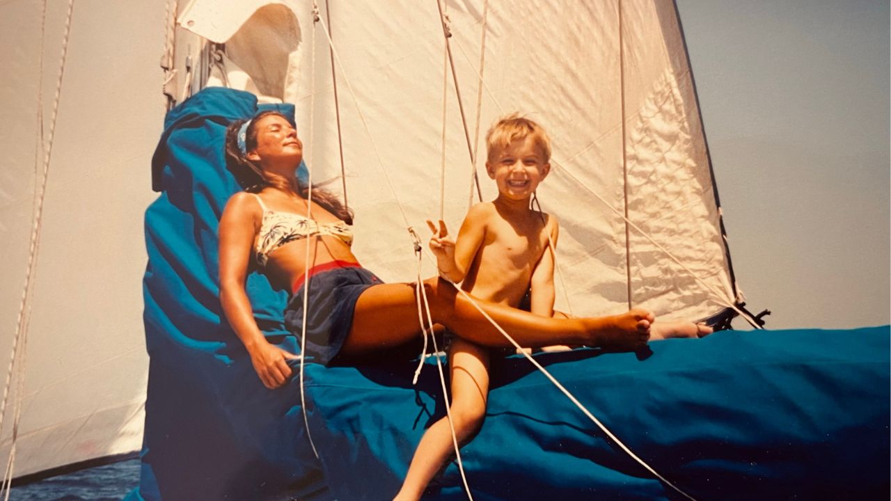 Xander and his mom on their sailboat in Greece
