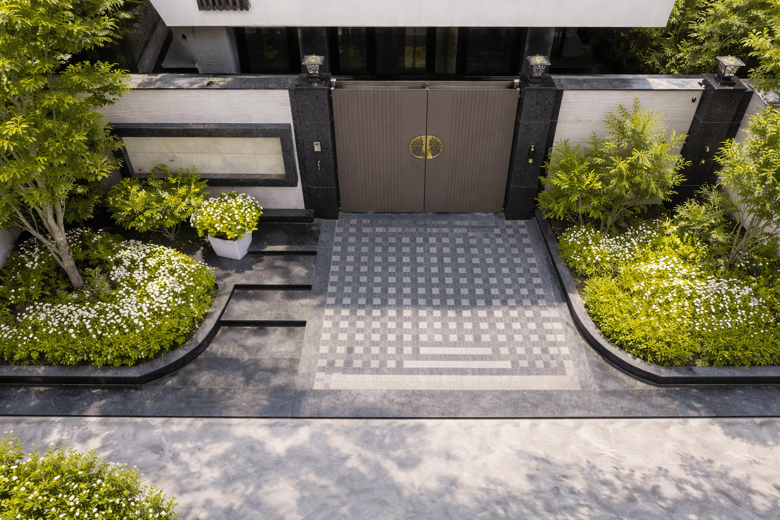 Stone driveway integrated with landscape design in modern residential property Ghaziabad