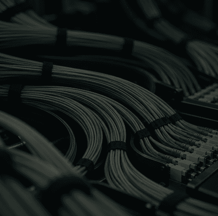 Bundled network cables connected to a data centre server rack