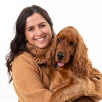 Profile portrait of a man in a white shirt against a light background