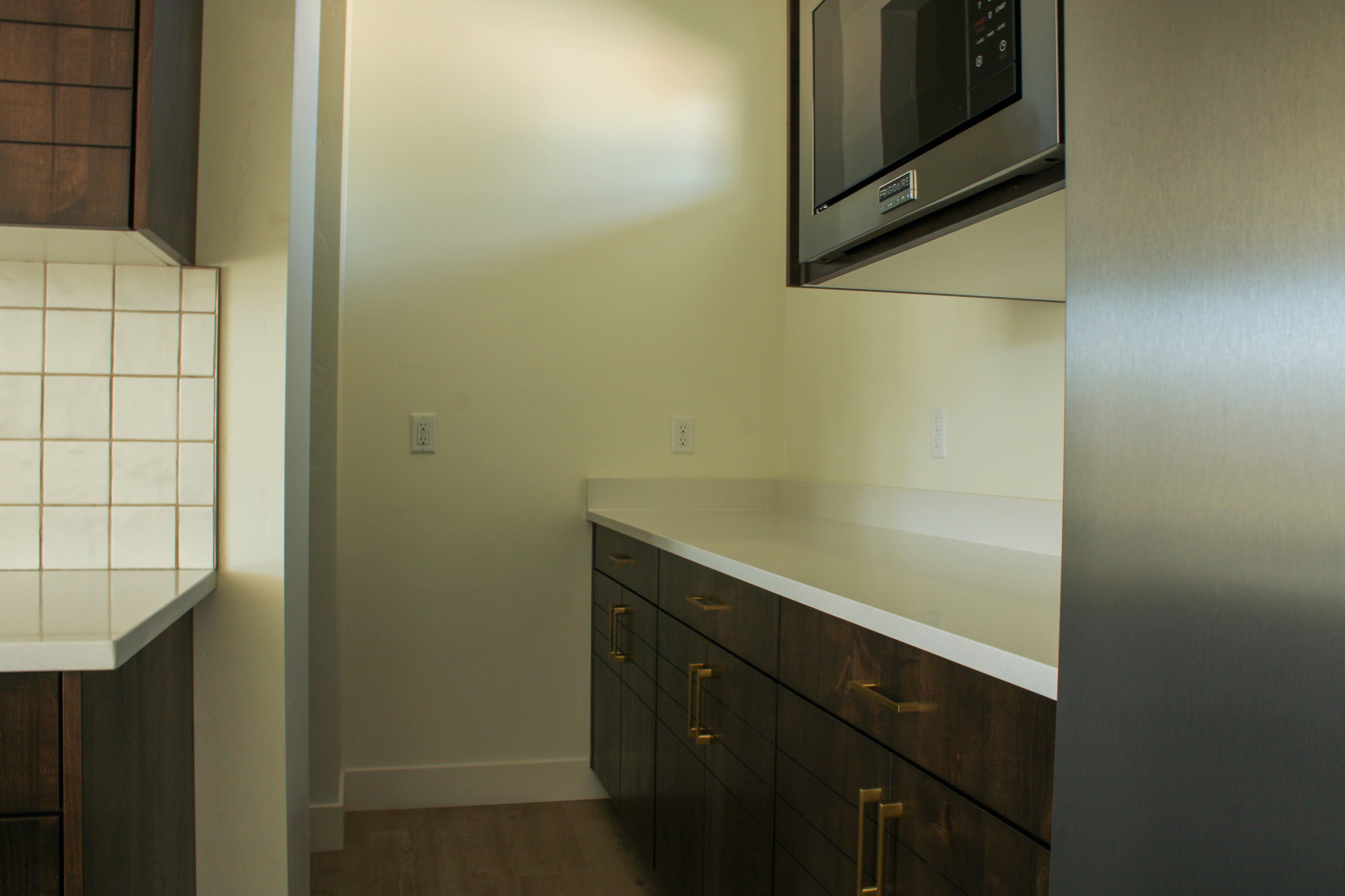 Prep kitchen at The Overlook at Falcon Ridge in Hurricane, Utah, featuring additional cabinetry, countertop workspace, and hidden storage.