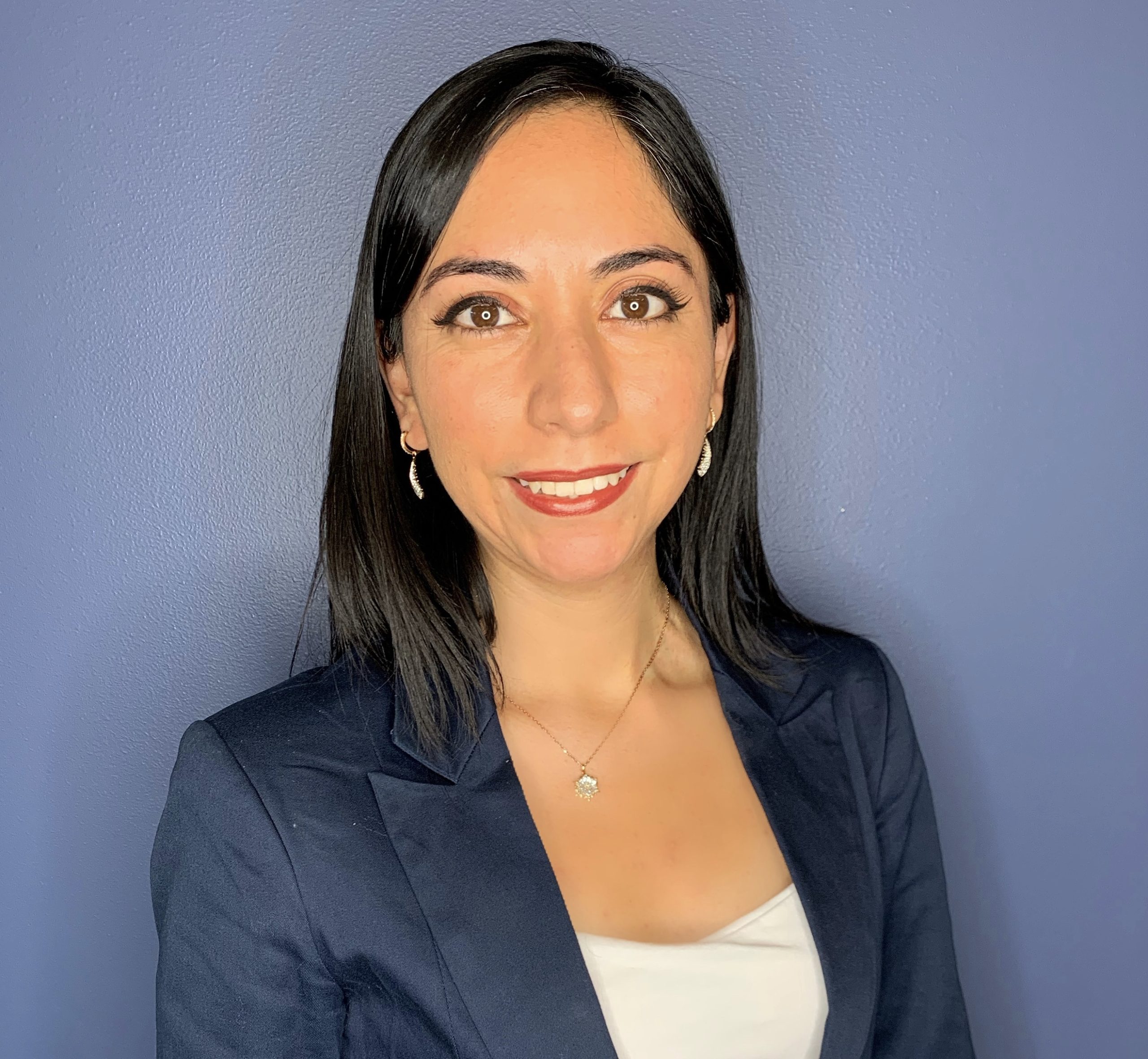 husband and wife working happily on a laptop