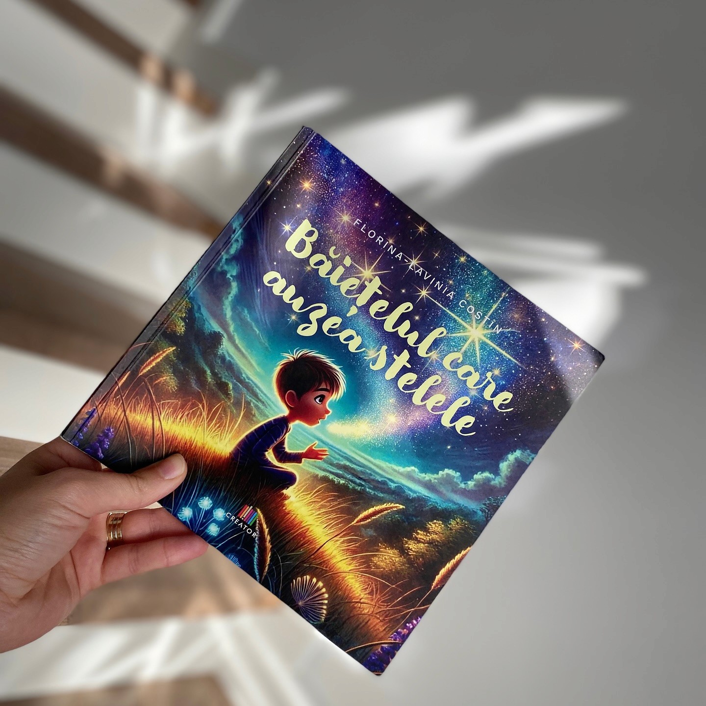 Close-up of a dark green leaf showing its textured surface and central vein against a muted background.