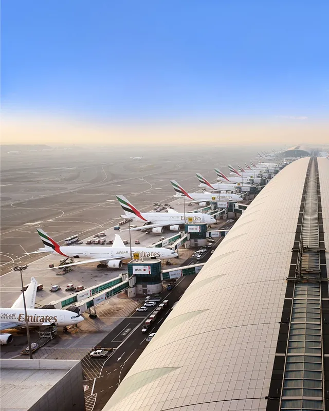 Young girl with backpack walks on dirt path