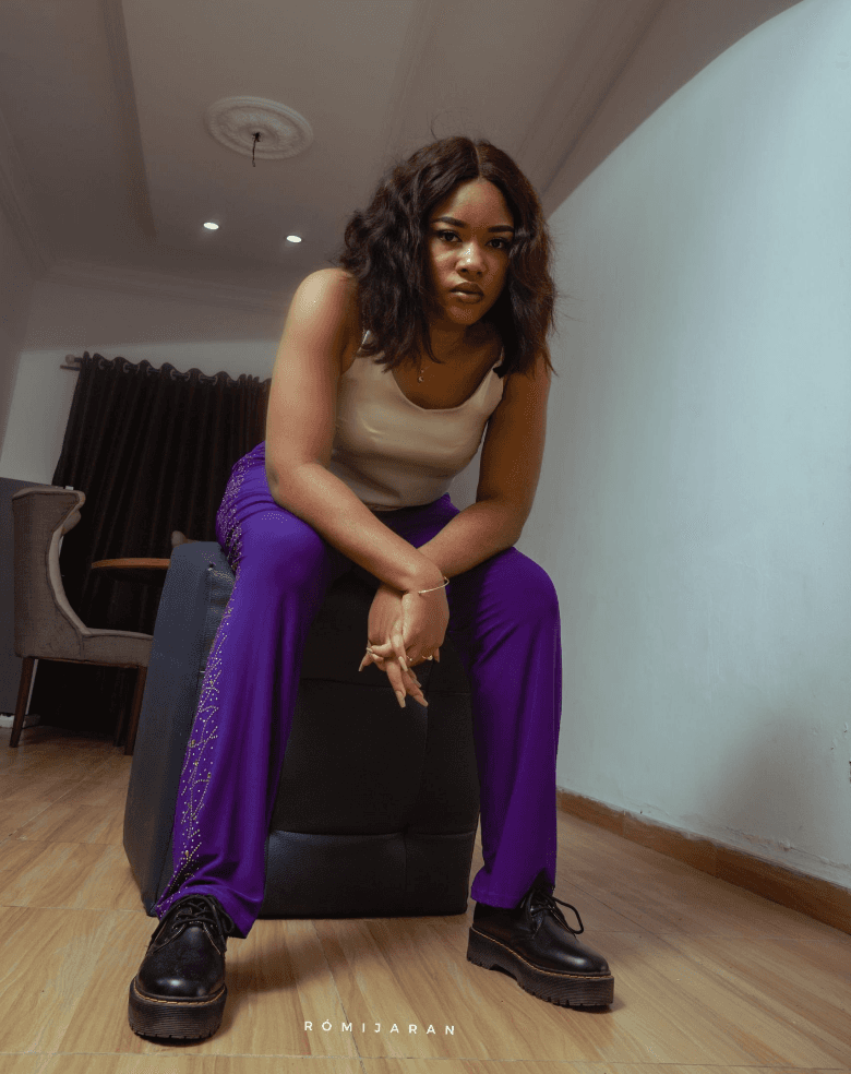 A photograph of Divine John-Okpala. photographed by Romijaran Studios